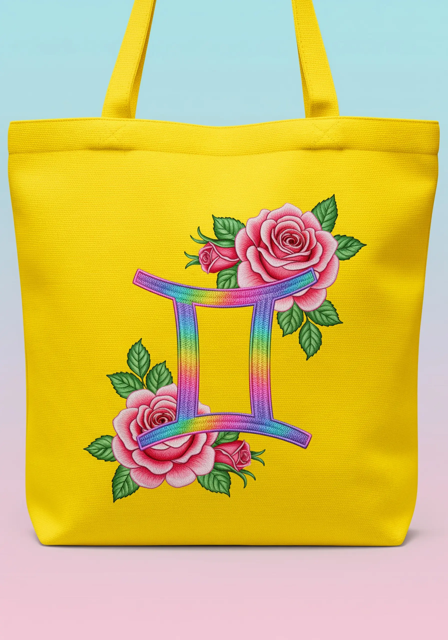 A Gemini zodiac symbol filled with a rainbow gradient satin stitch, flanked by pink roses.