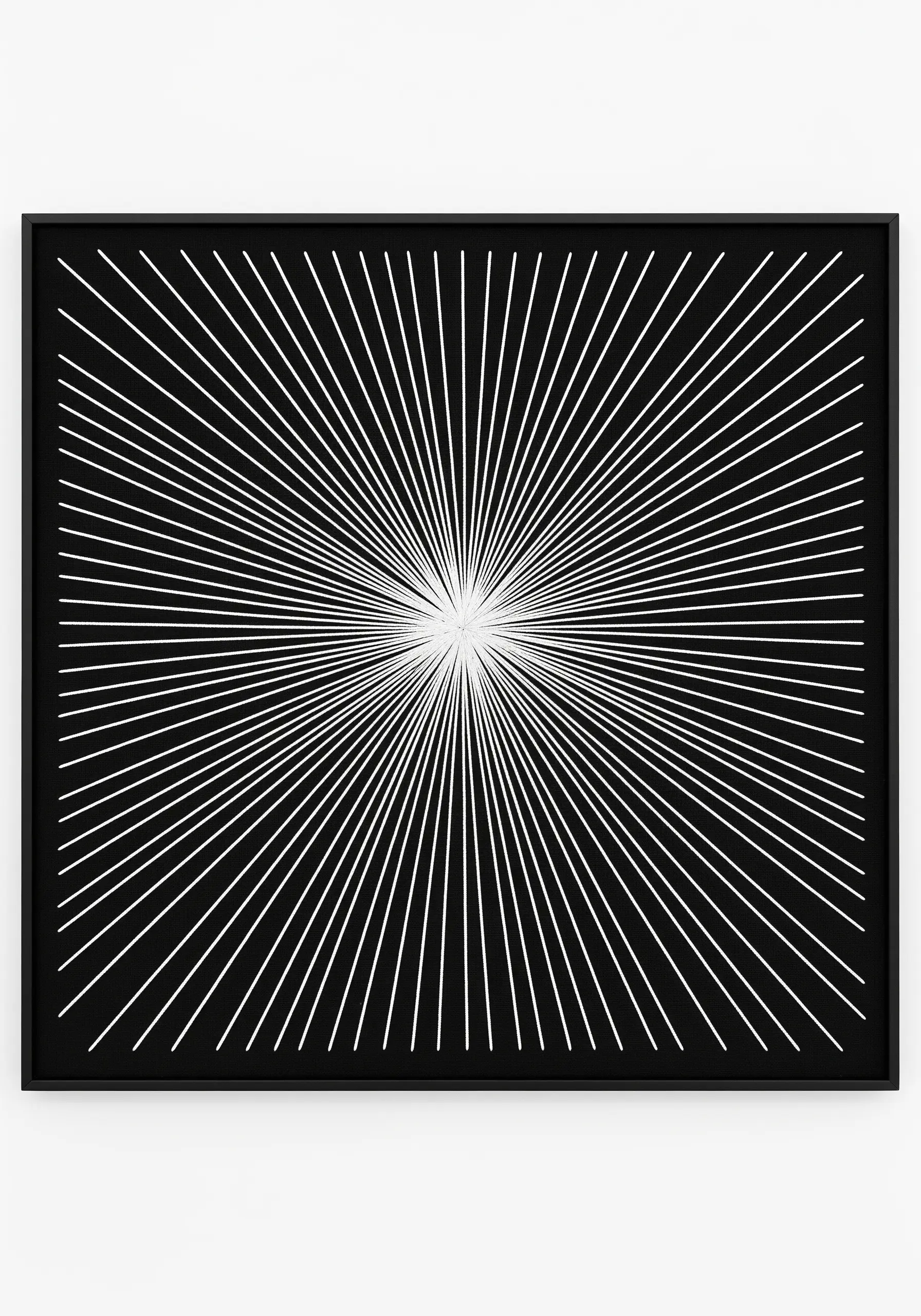 A starburst of white lines radiating from a central point on a black background.