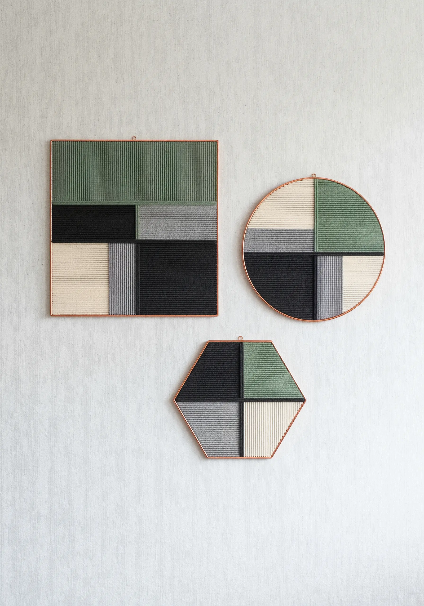Three geometric frames—square, circle, hexagon—with color-blocked wrapped thread in green, black, grey, and cream.
