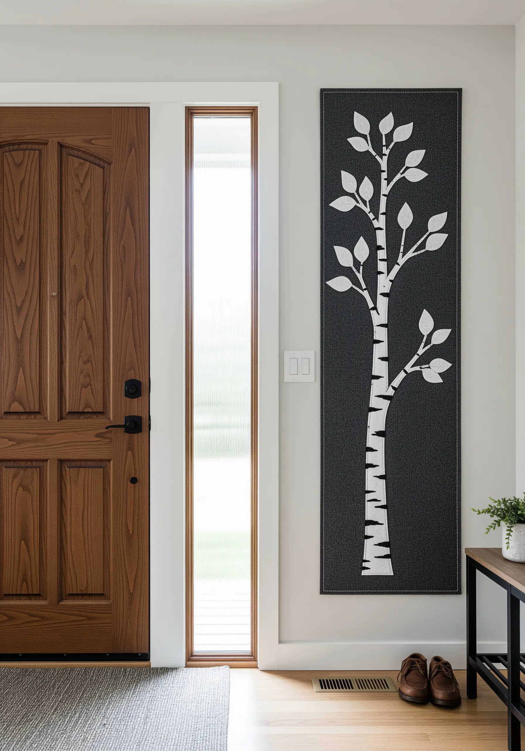 Modern wall panel with a stylized white birch tree on a dark background.