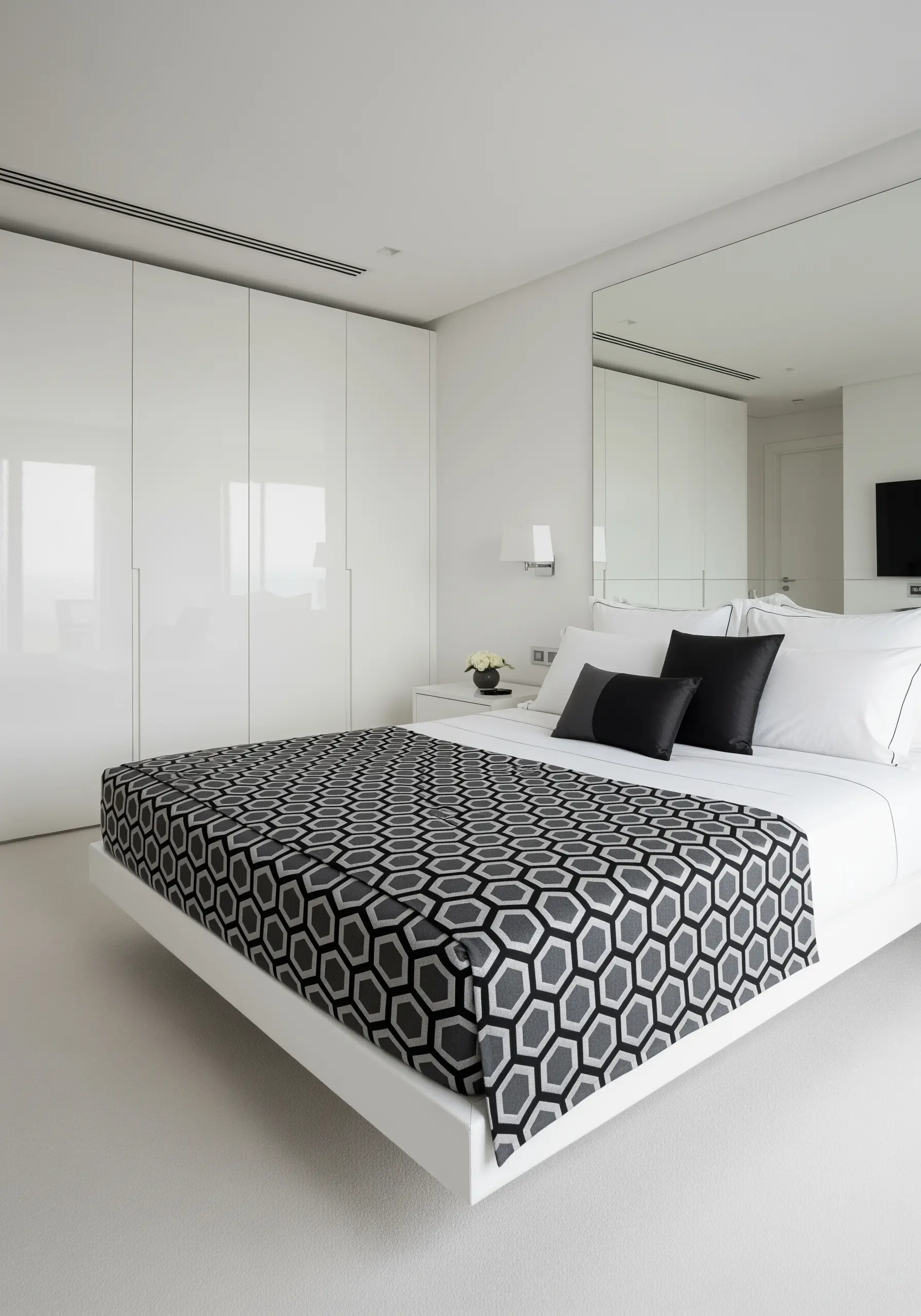 A modern bed runner with a crisp, repeating geometric honeycomb pattern in black, white, and gray.