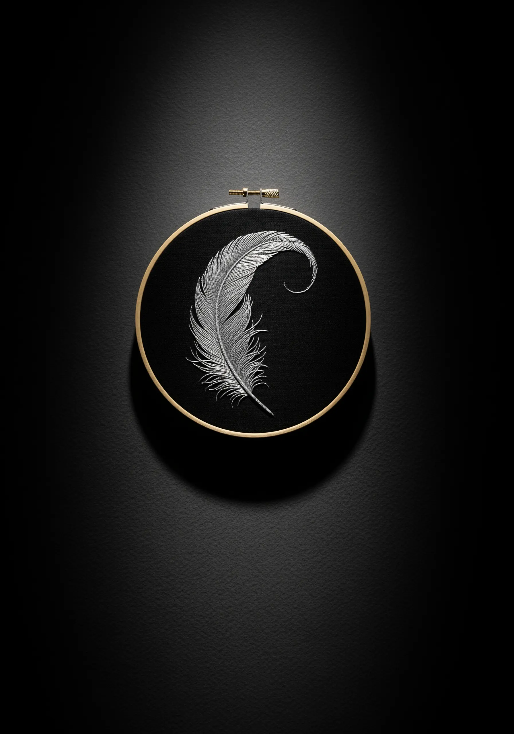 A highly detailed, realistic white feather embroidered on black fabric.