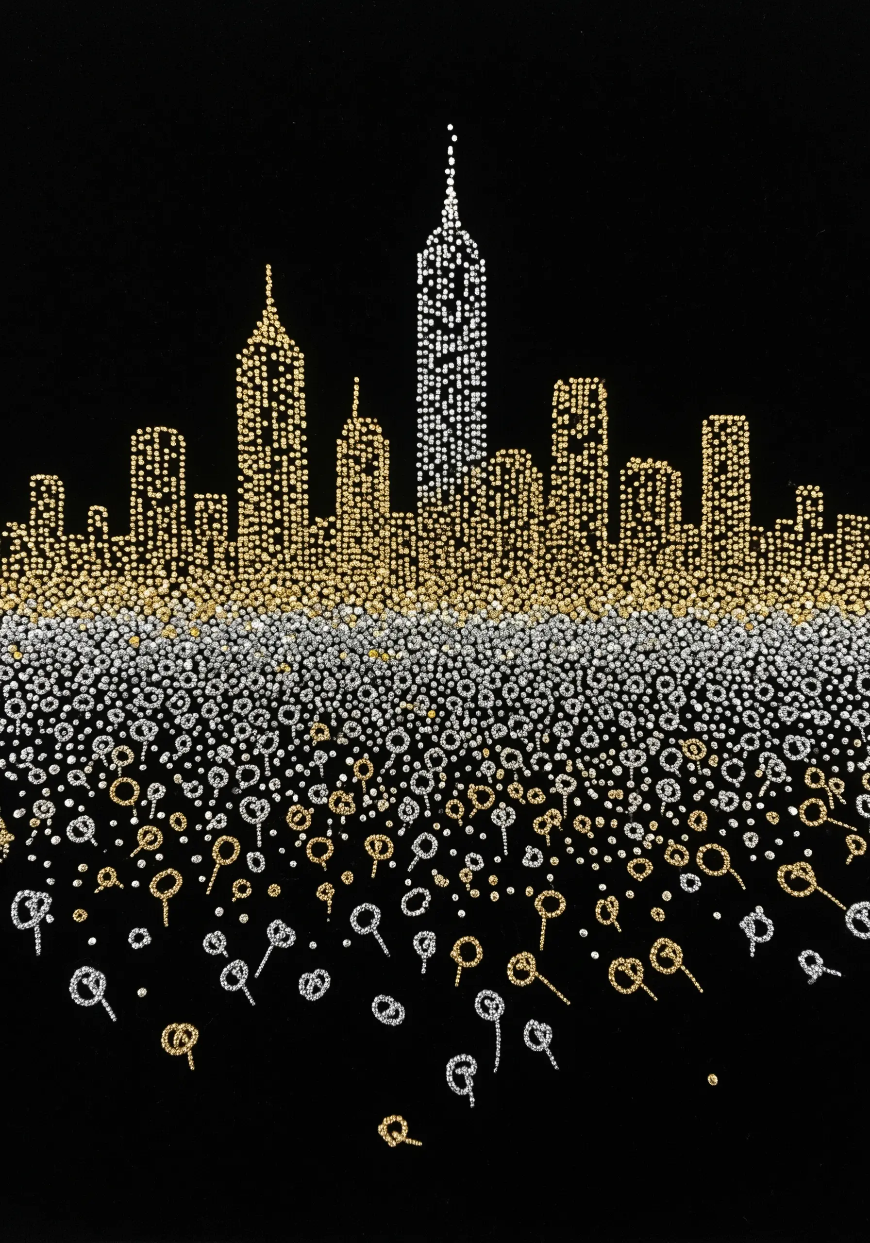 A city skyline created with thousands of gold and silver metallic French knots on black fabric.