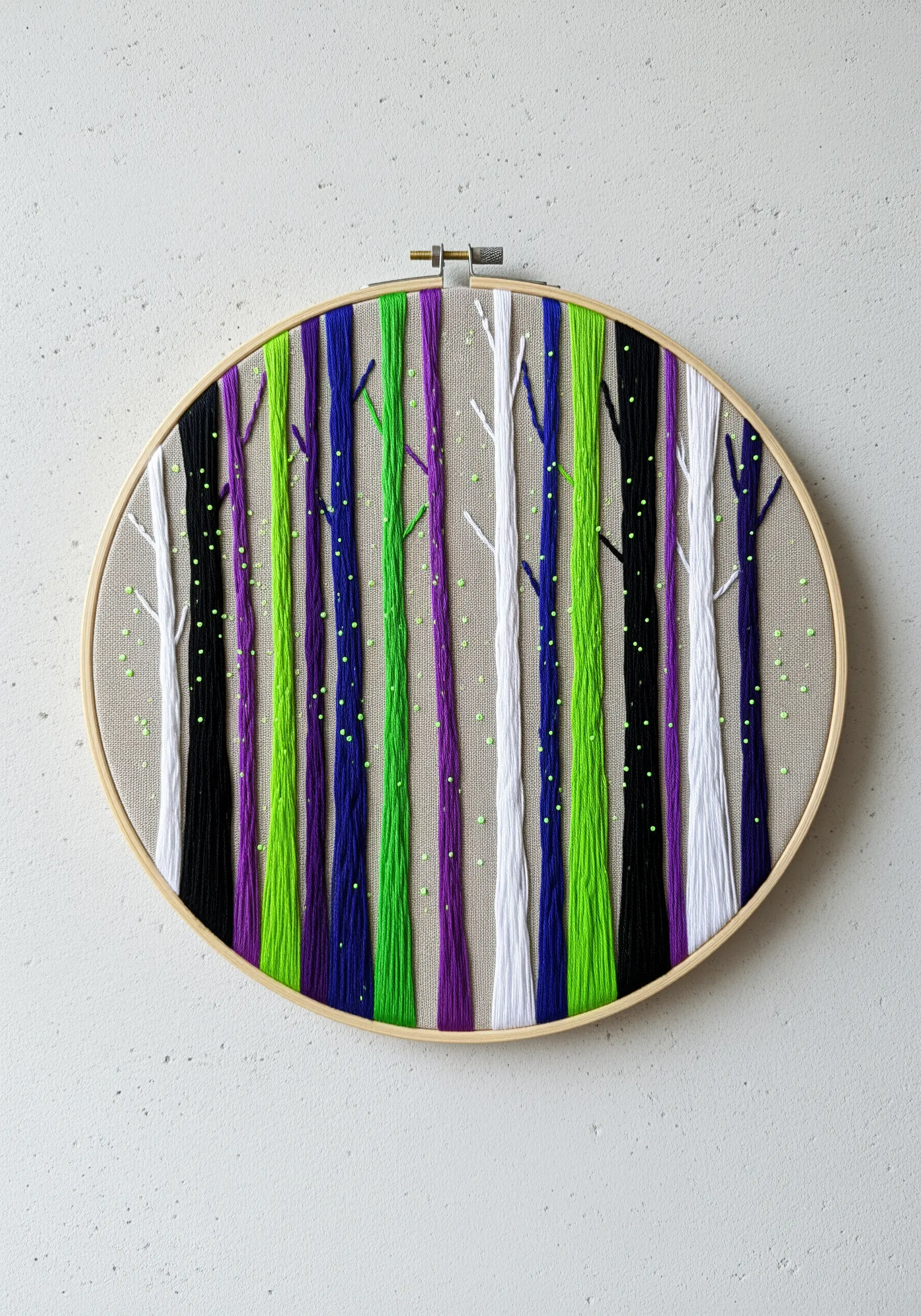 Abstract forest made of vertical stitches in purple, green, white, and black with neon green knots.