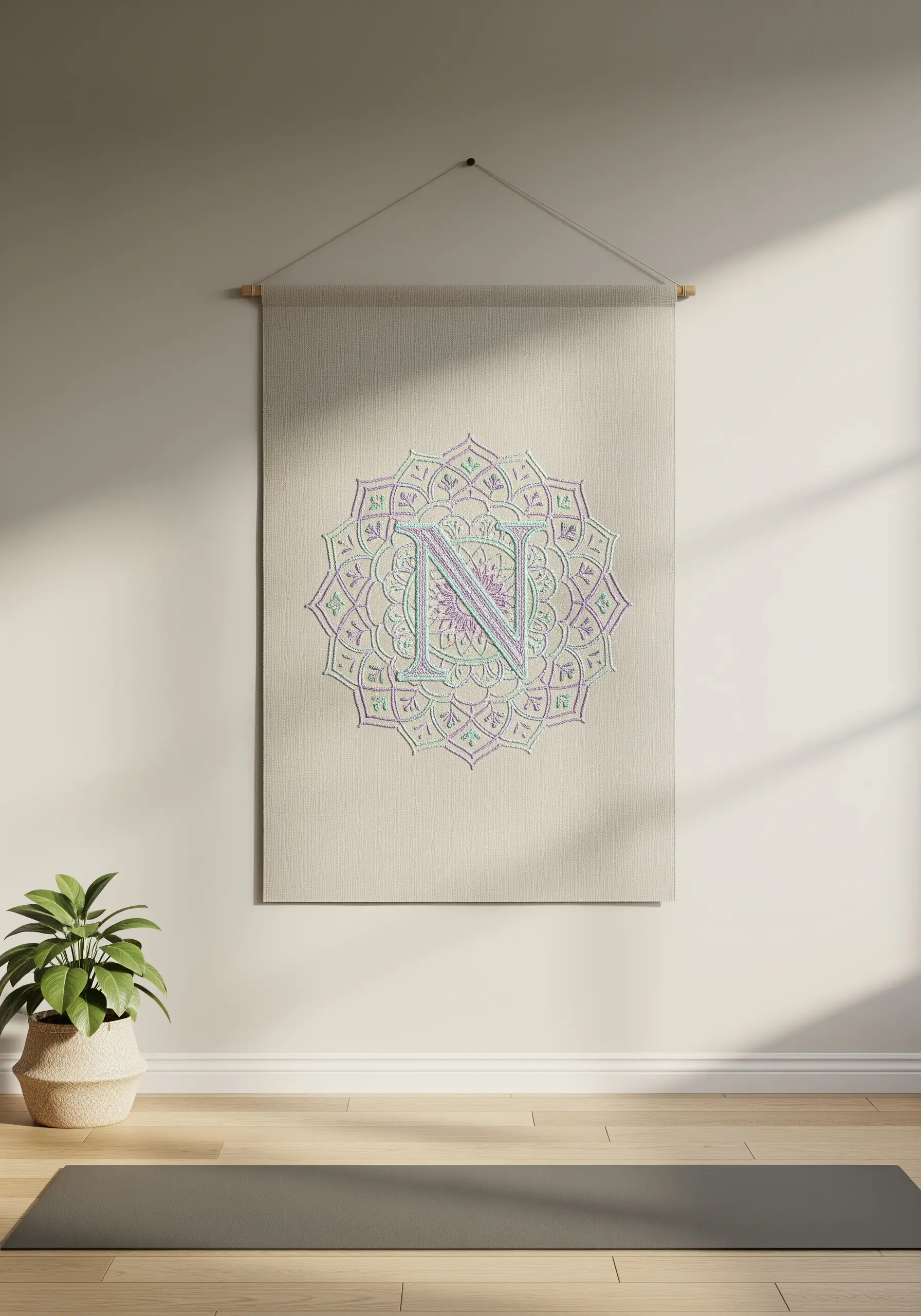 Monogram 'N' integrated into a large, delicately stitched pastel mandala design.