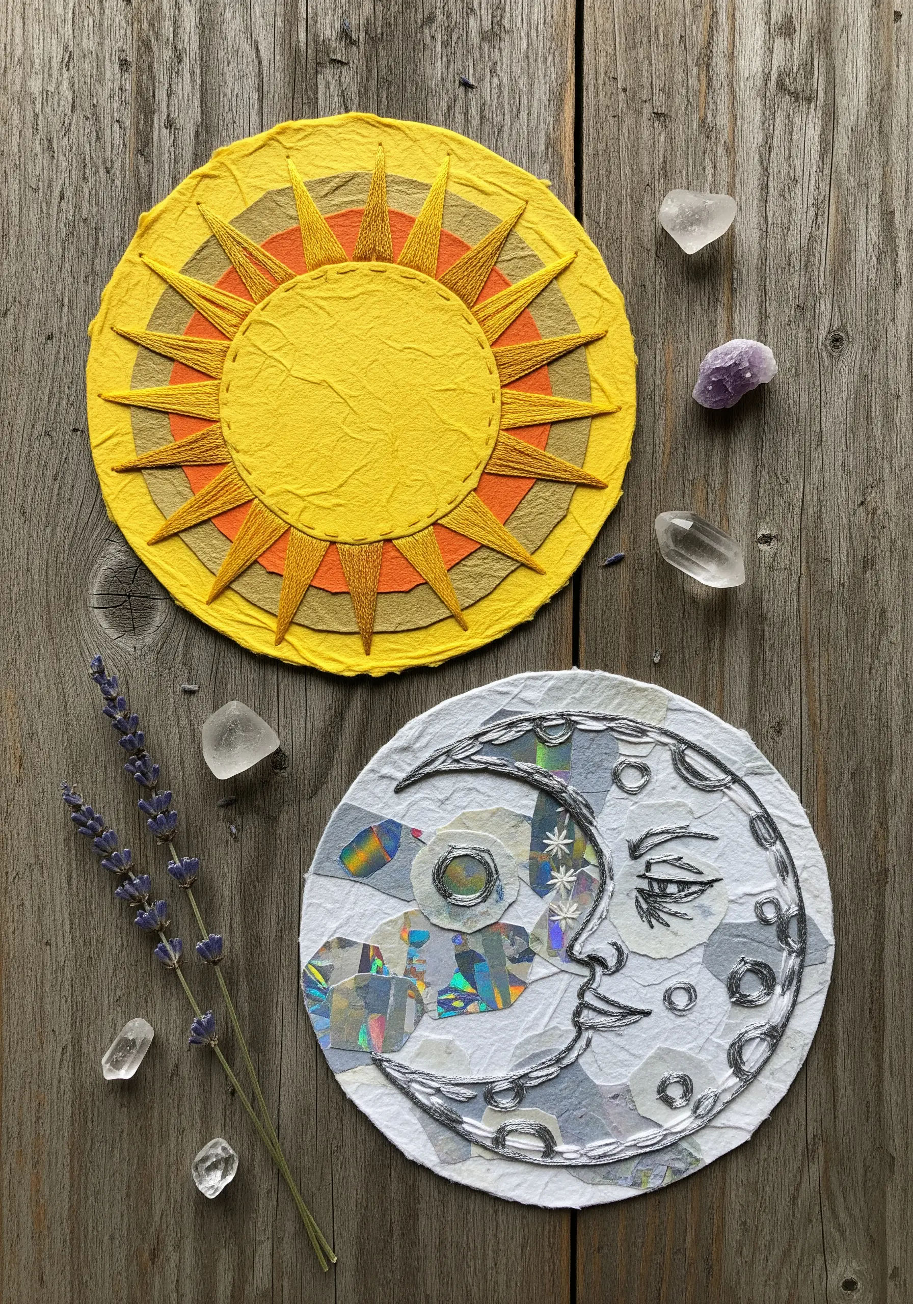 A sun and moon collage; the sun has orange thread rays and the moon has a silver thread outline.