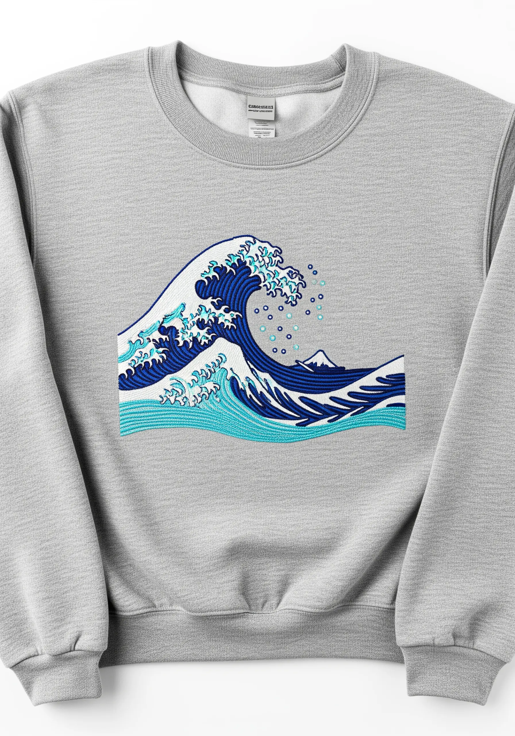 Embroidery of 'The Great Wave off Kanagawa' on the chest of a grey sweatshirt.