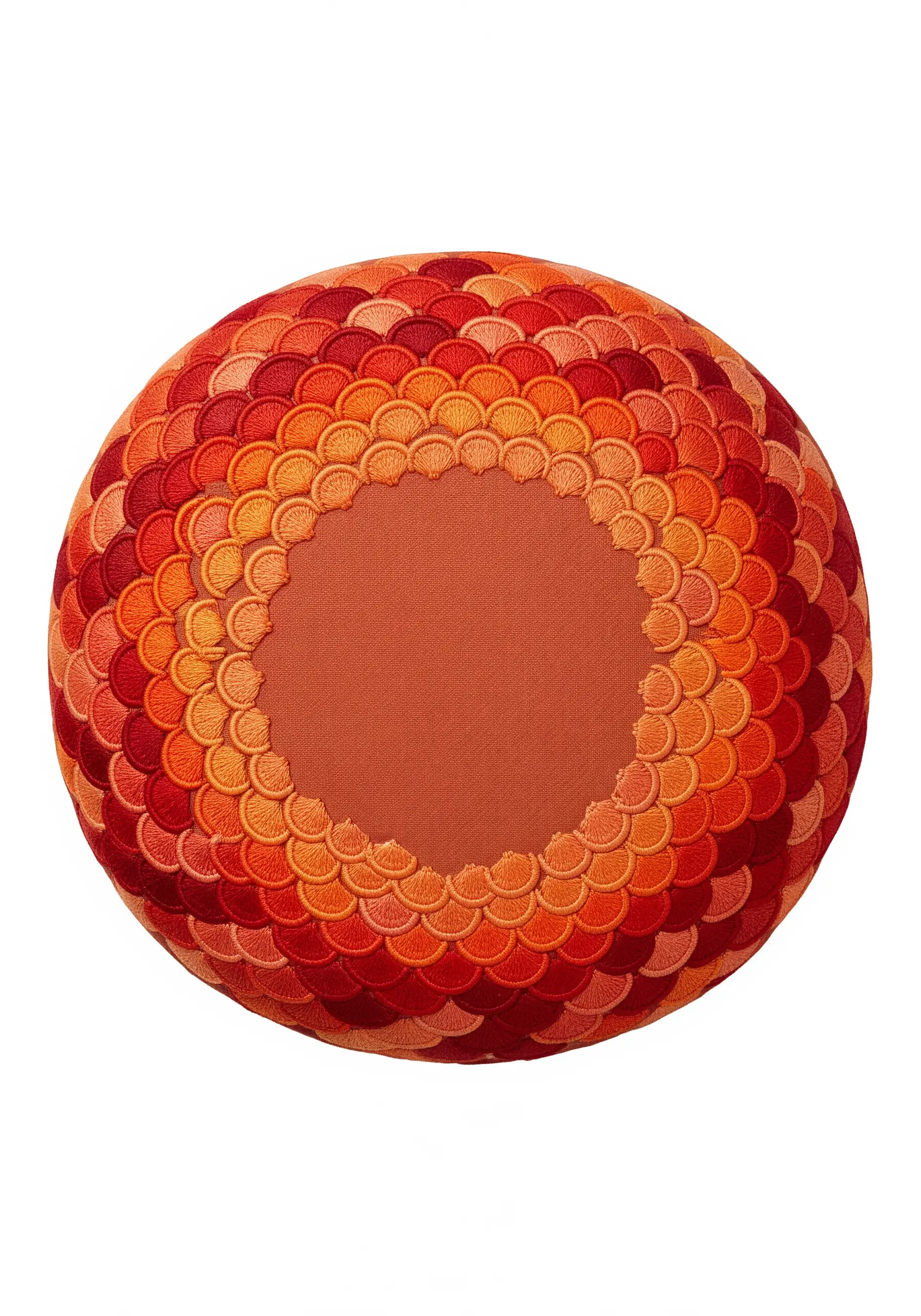 A round cushion covered in layered, satin-stitched scallops in a gradient of oranges and reds