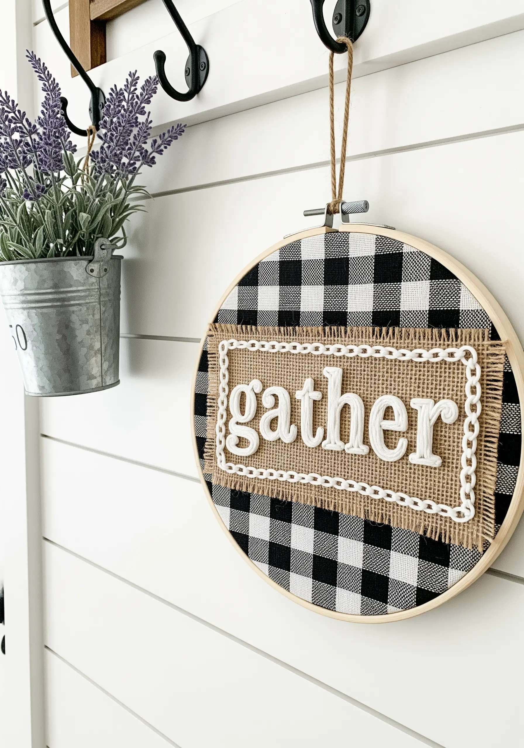 Mixed-media embroidery with 'gather' in couched yarn on a burlap and gingham background.