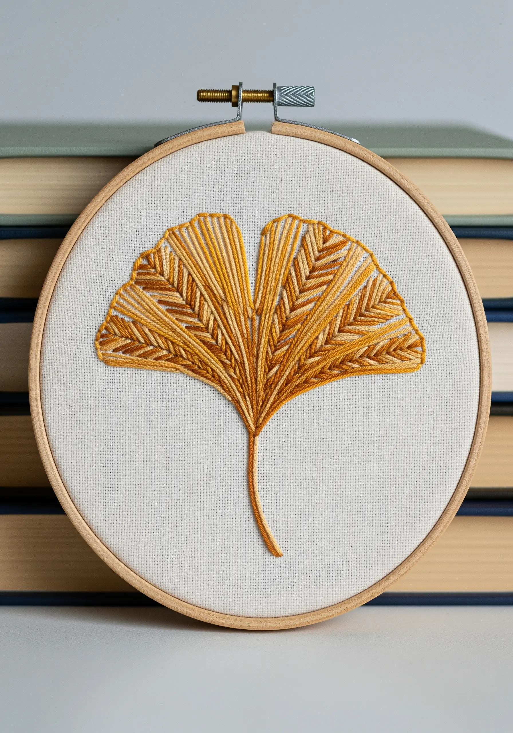 Embroidered ginkgo leaf using variegated thread for a color gradient.