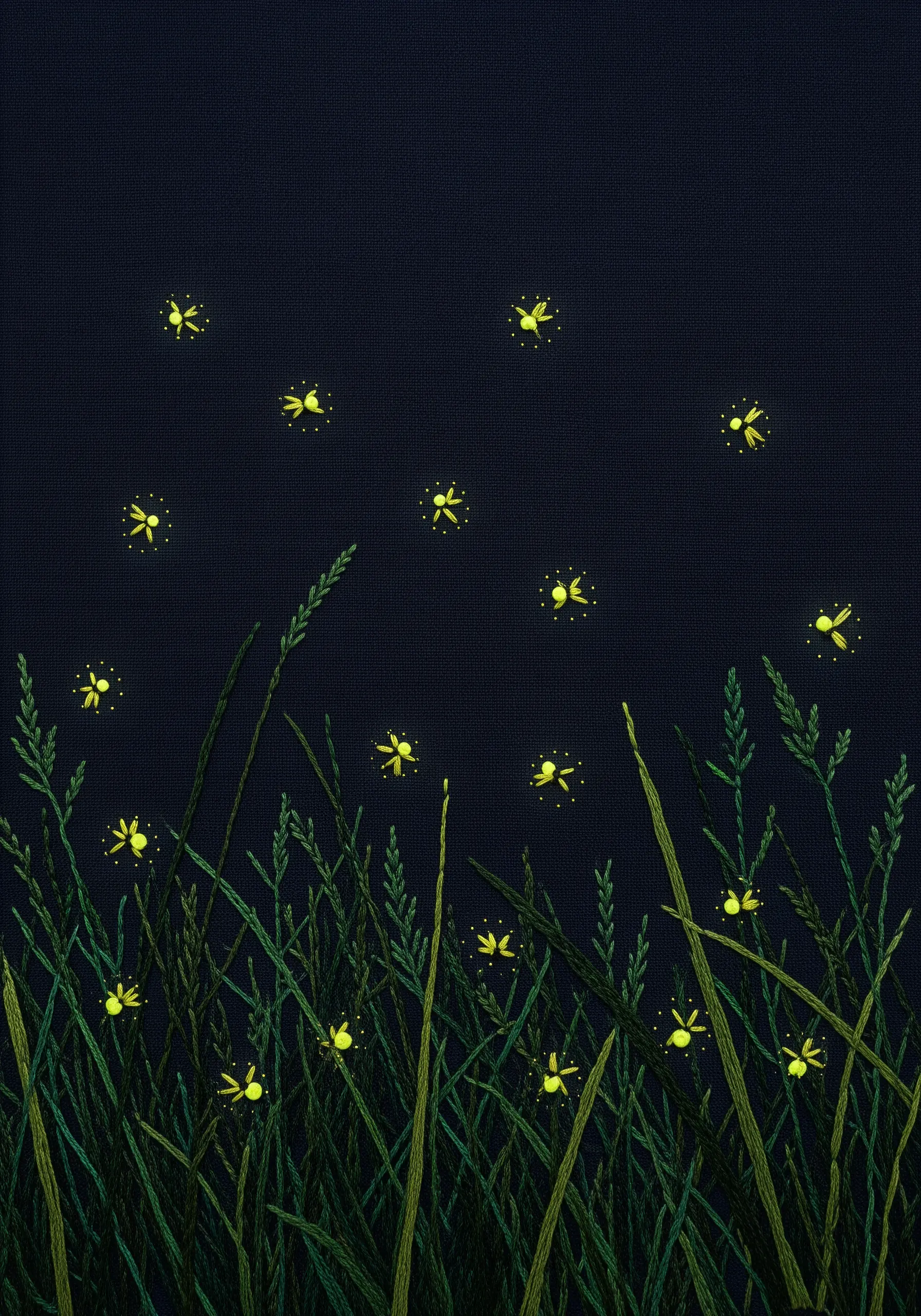 Embroidery of glowing yellow fireflies in tall green grass against a dark background.