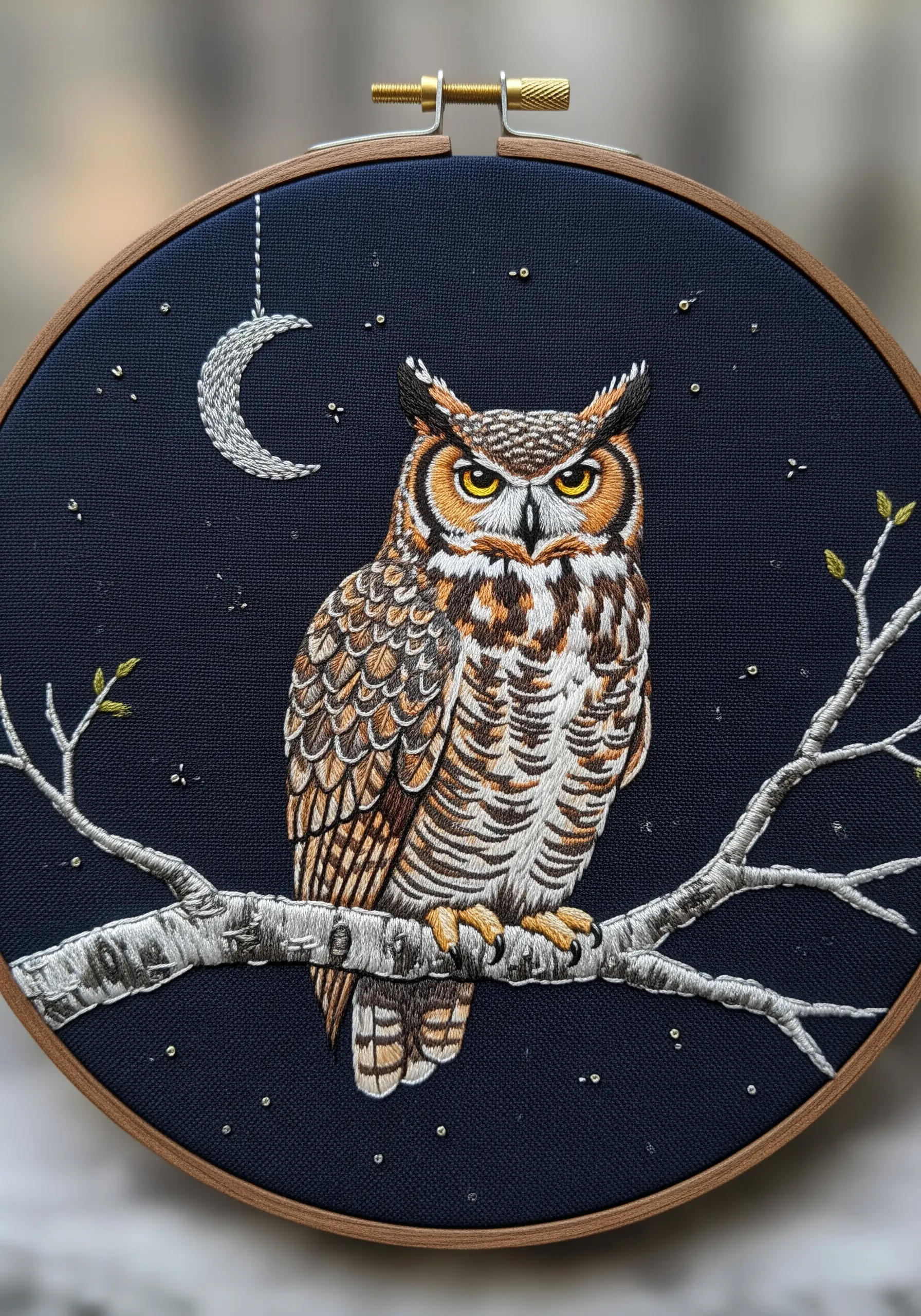 Hyper-realistic thread-painted horned owl on a branch against a dark night sky with a crescent moon.