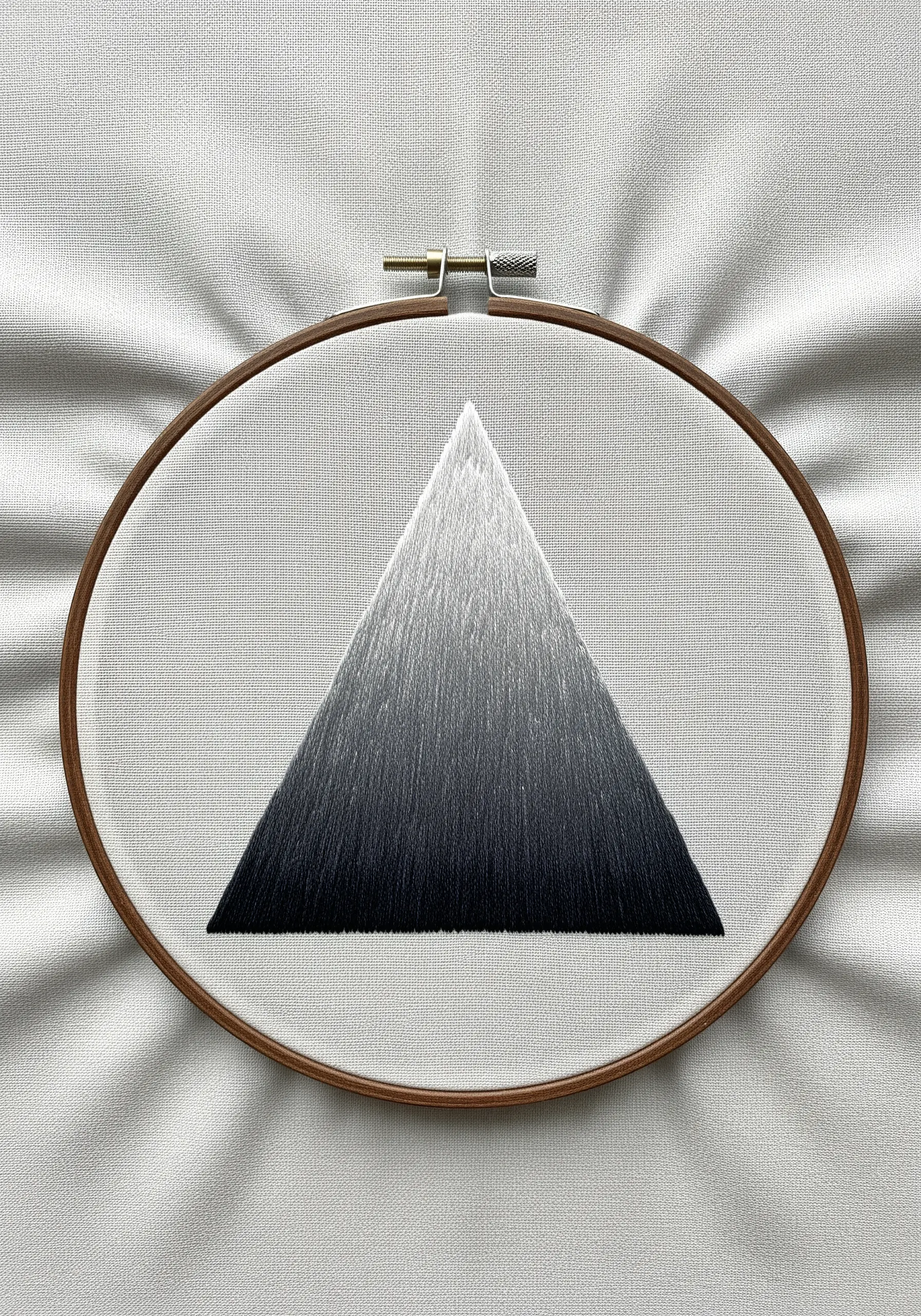 A perfect black-to-white gradient embroidered in a triangle shape.