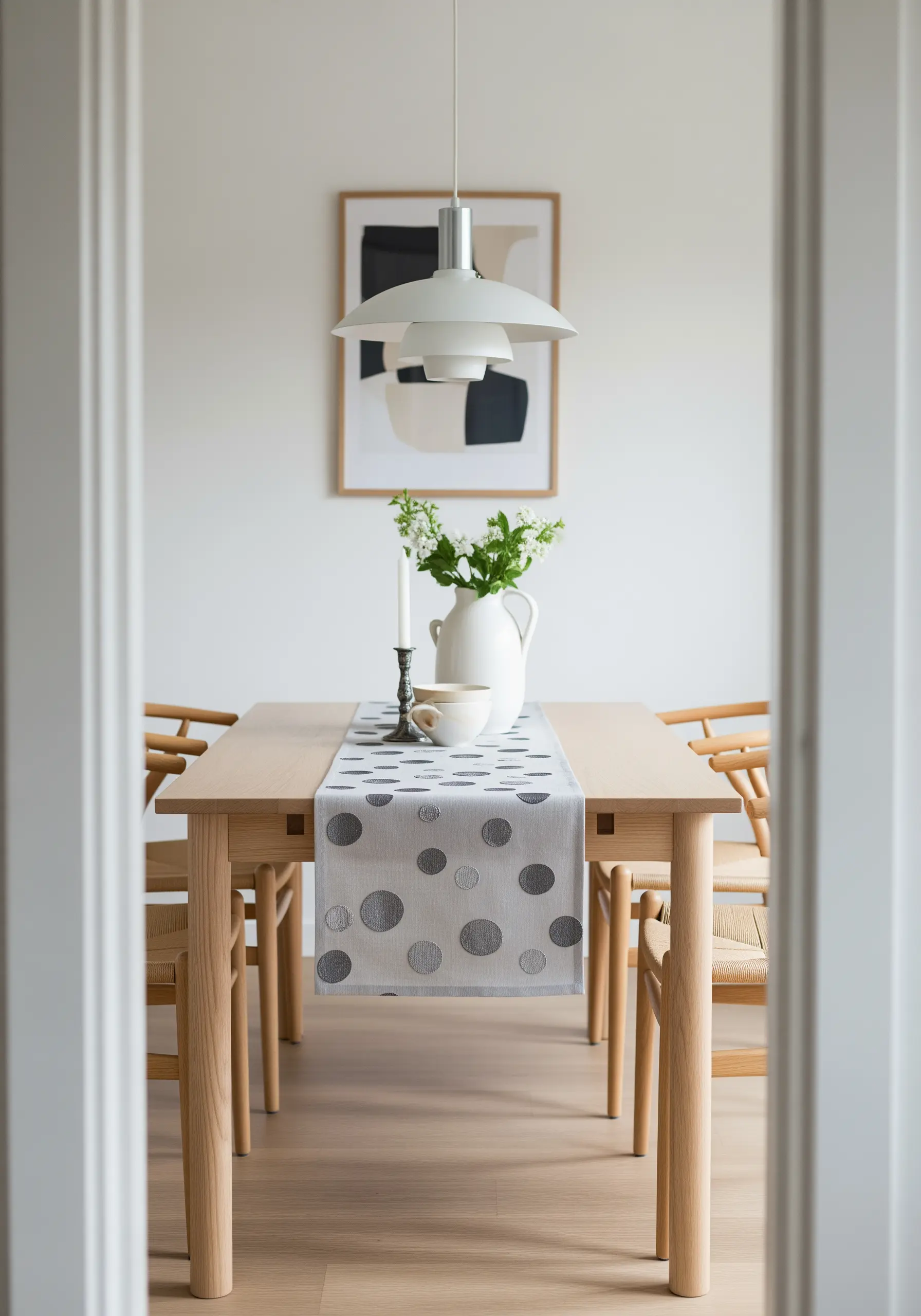 Satin-stitched polka dots in varying shades of gray on a table runner