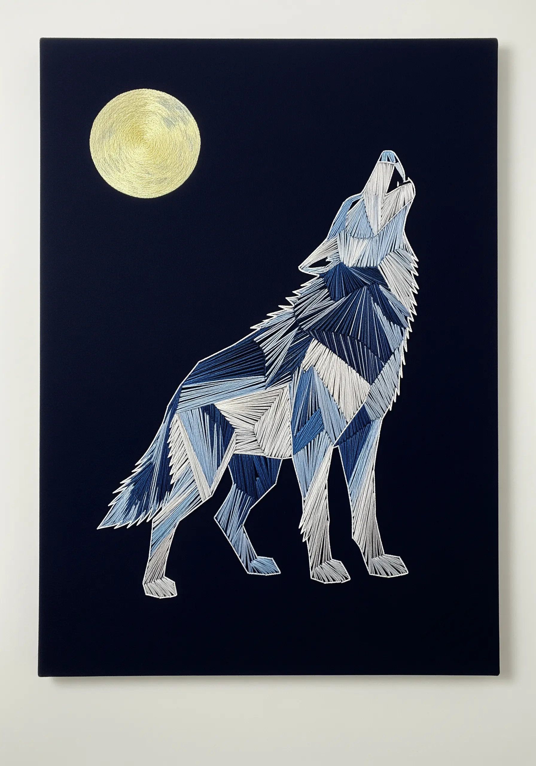 Geometric wolf howling at a golden moon, embroidered in shades of blue and white on dark fabric.