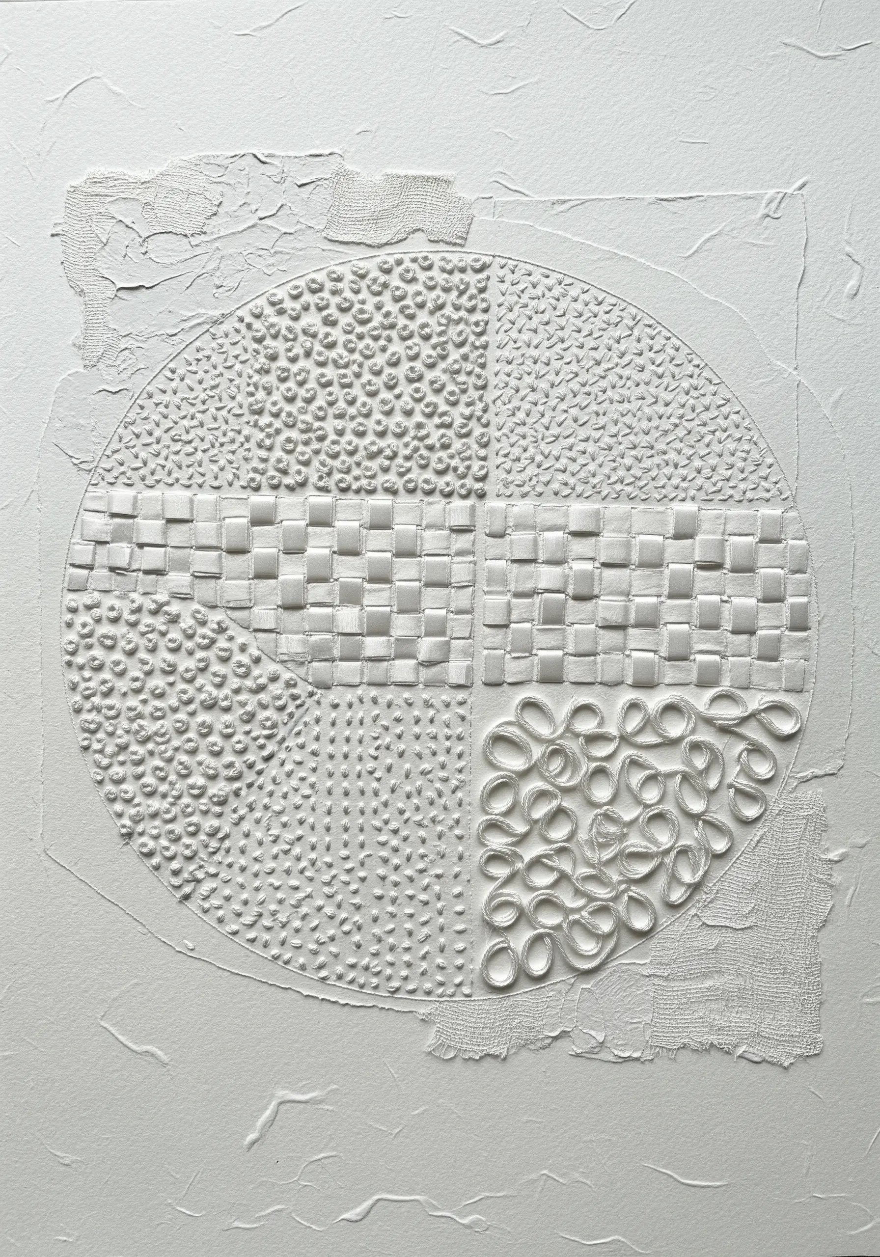 White-on-white abstract mixed-media art with woven paper and various embroidery textures.