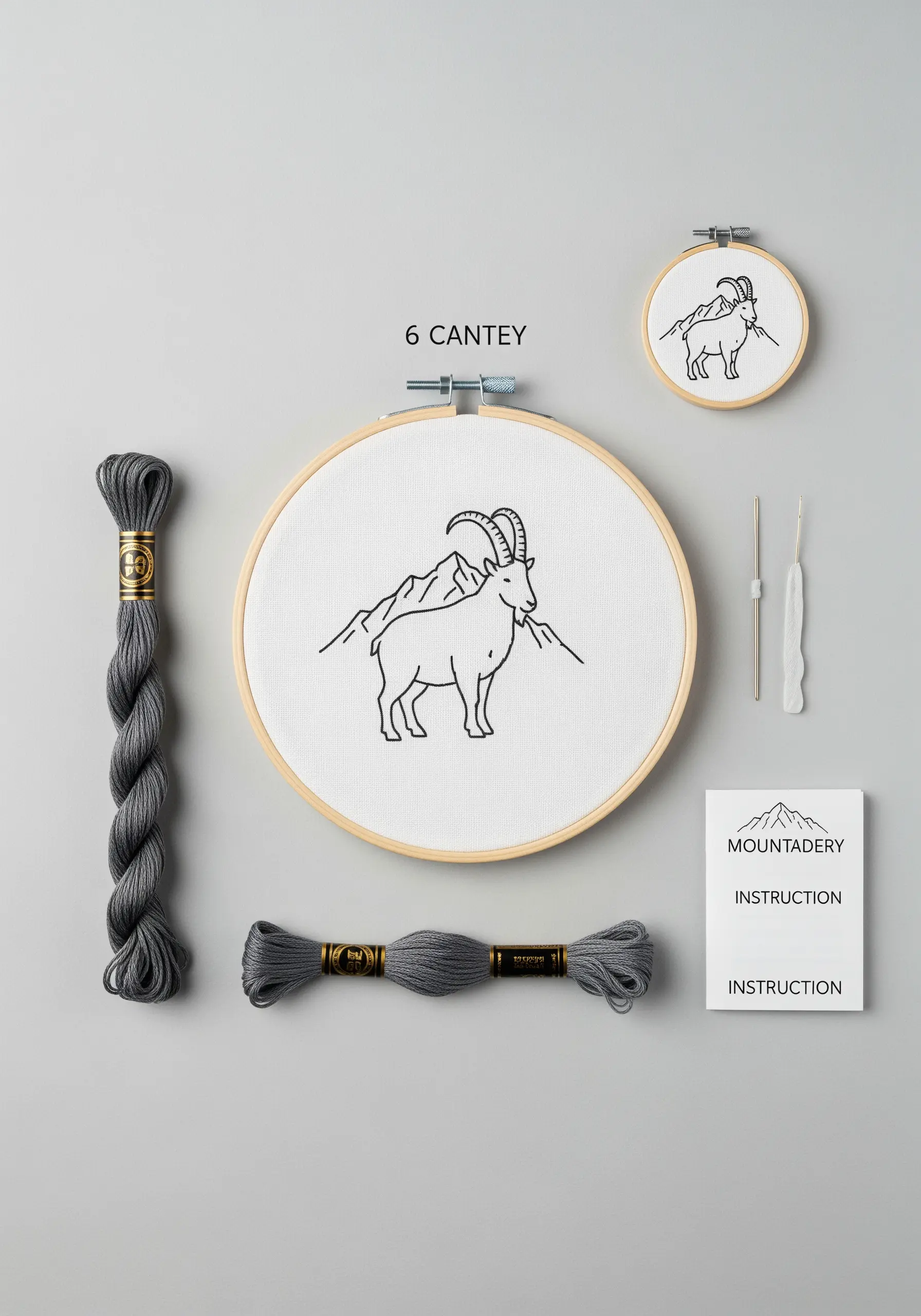 A minimalist embroidery kit with a mountain goat design, thread, hoop, and instructions.