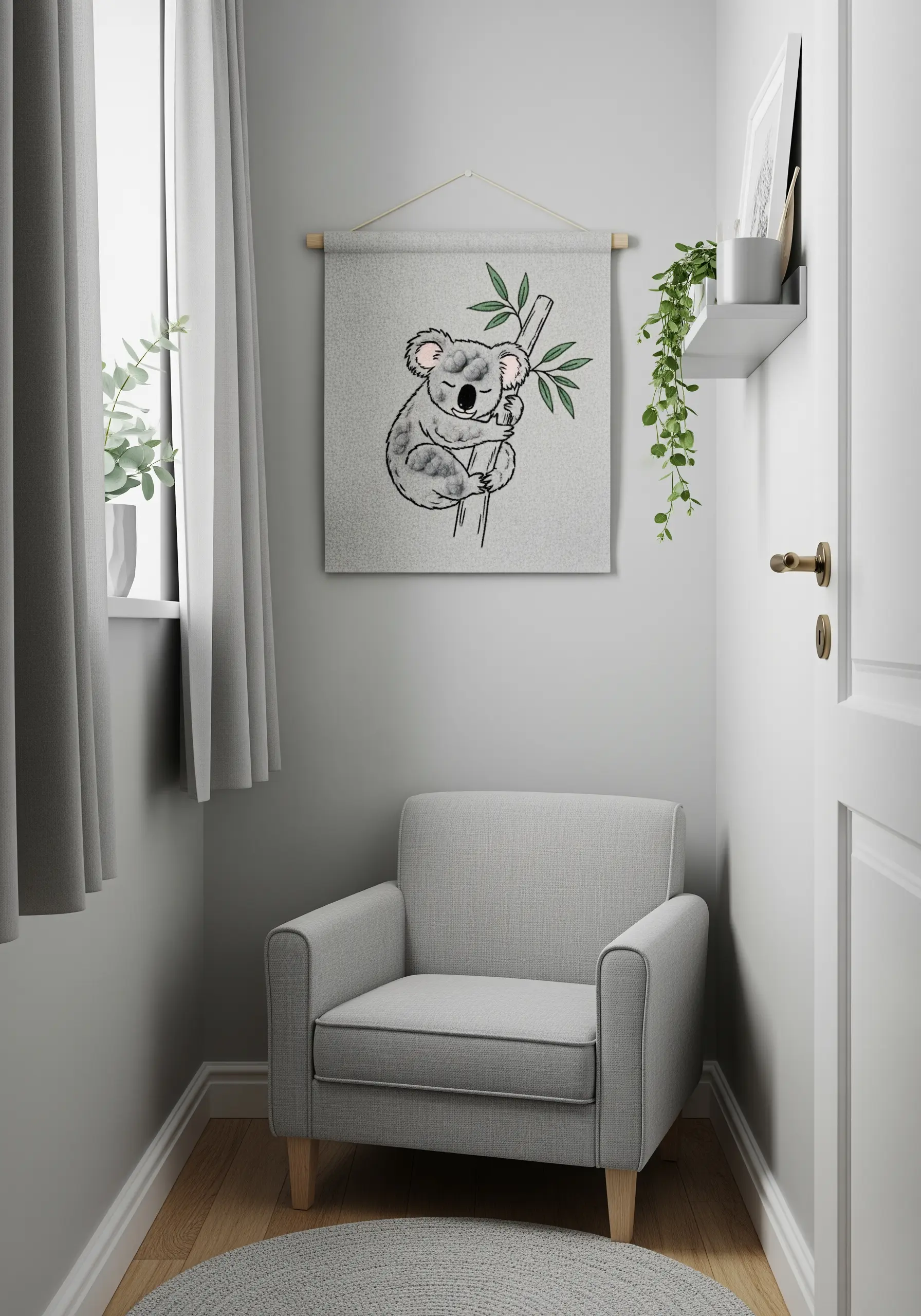 An embroidered koala on a branch, displayed as a fabric wall banner hanging in a cozy gray corner.