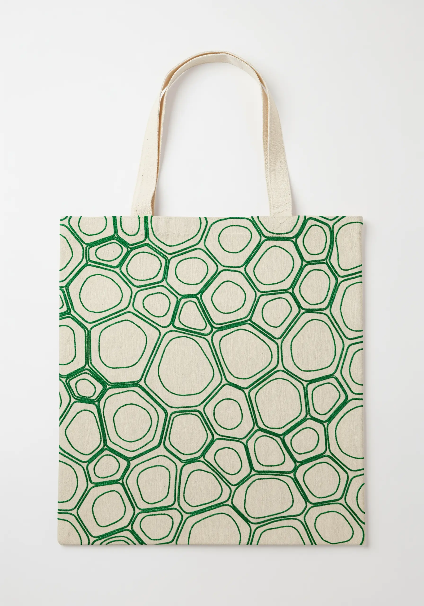 An all-over pattern of interconnected organic cell-like shapes in green outline stitch.