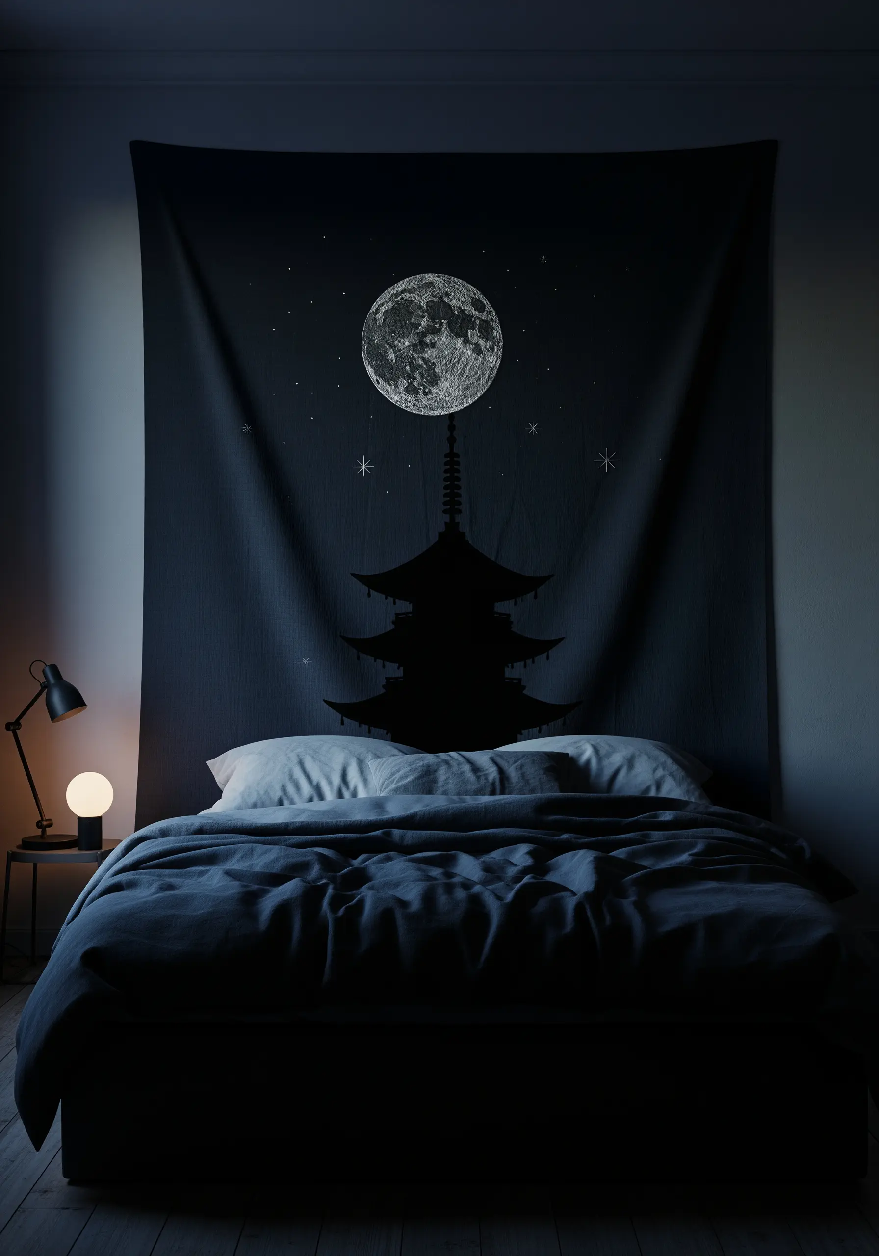 A black wall tapestry with an embroidered moon, stars, and a pagoda silhouette.