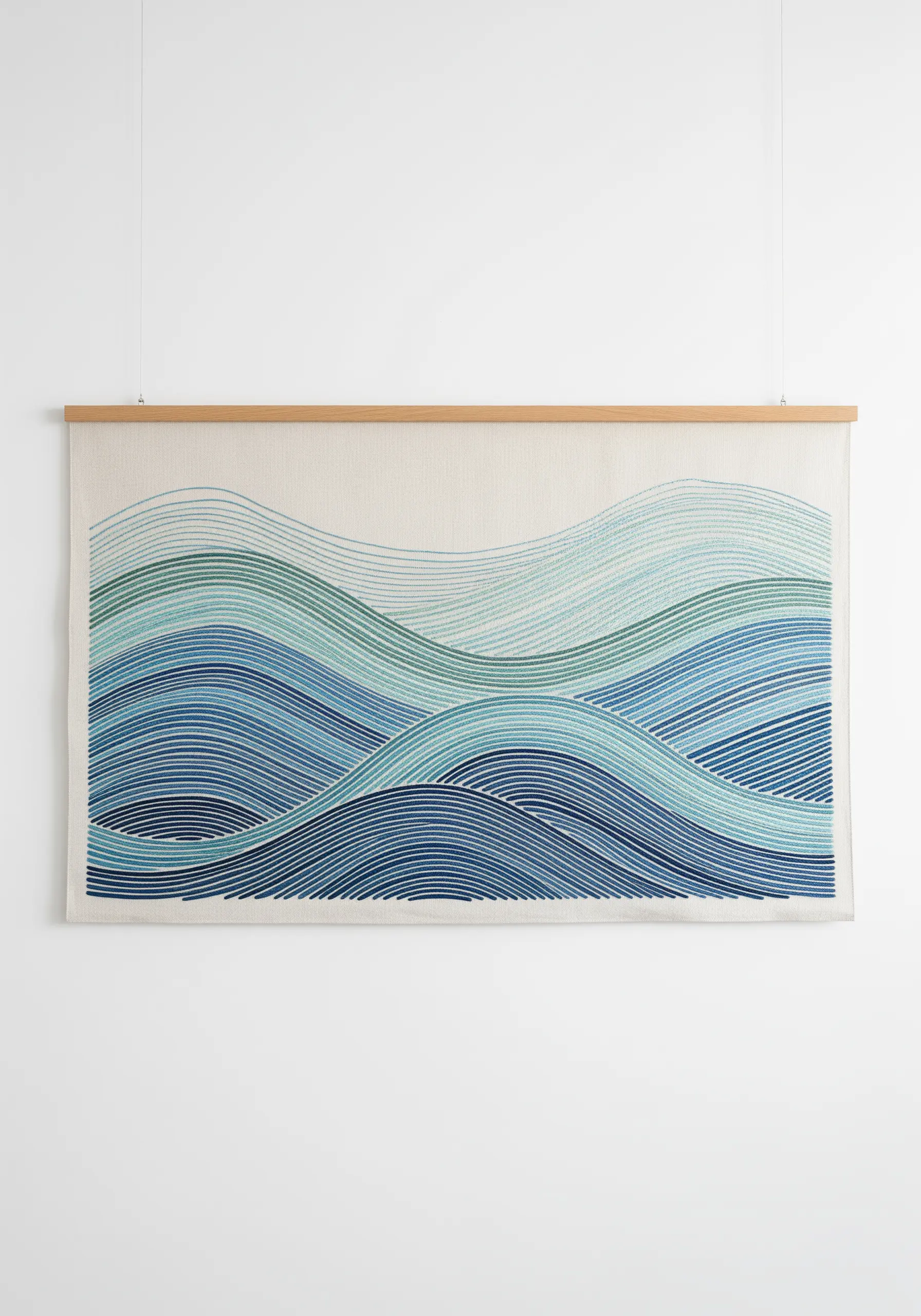 Large embroidered wall hanging depicting ocean waves in shades of blue and green running stitch.