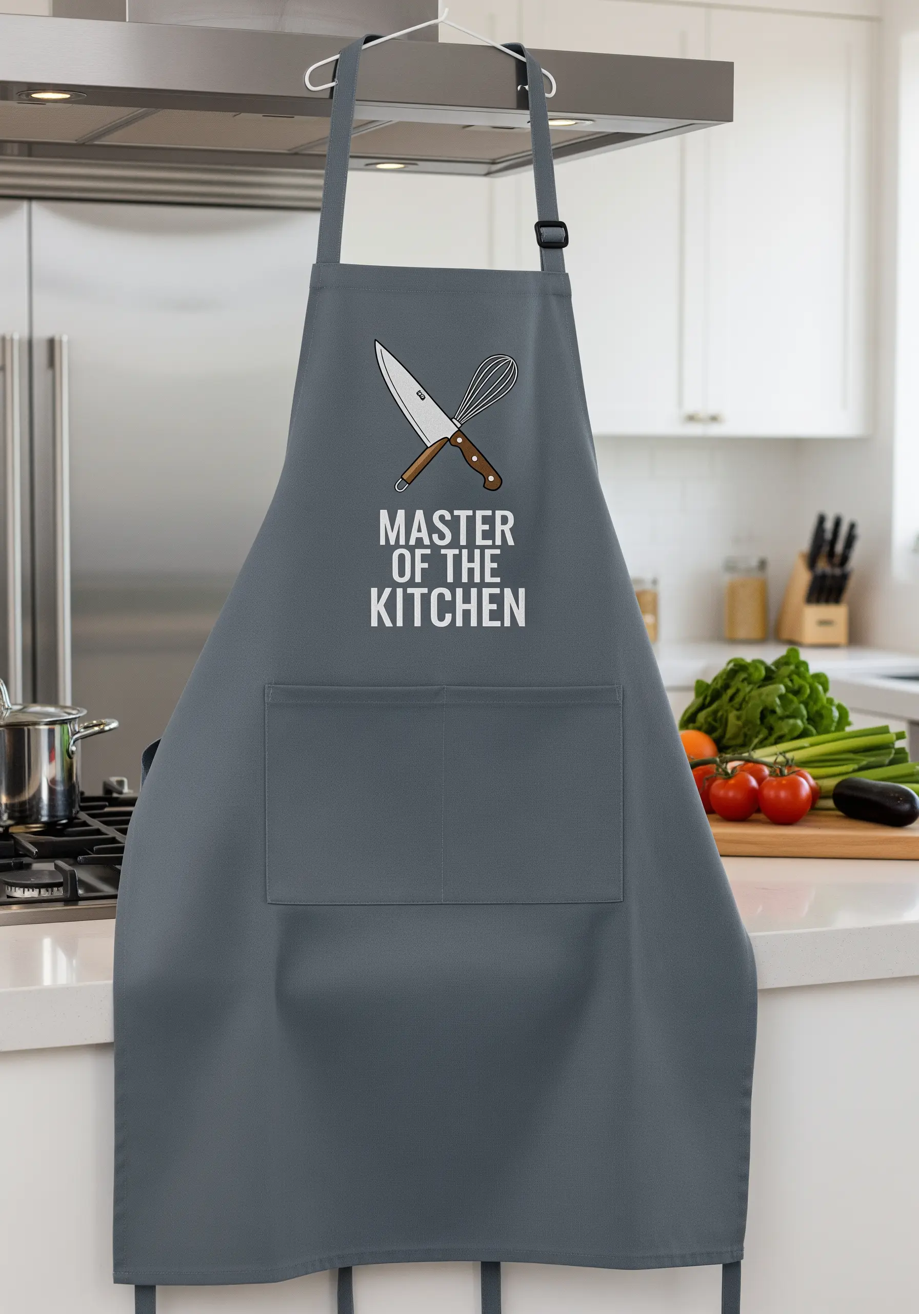 A gray kitchen apron with the embroidered text 'Master of the Kitchen' and a crossed knife and whisk.