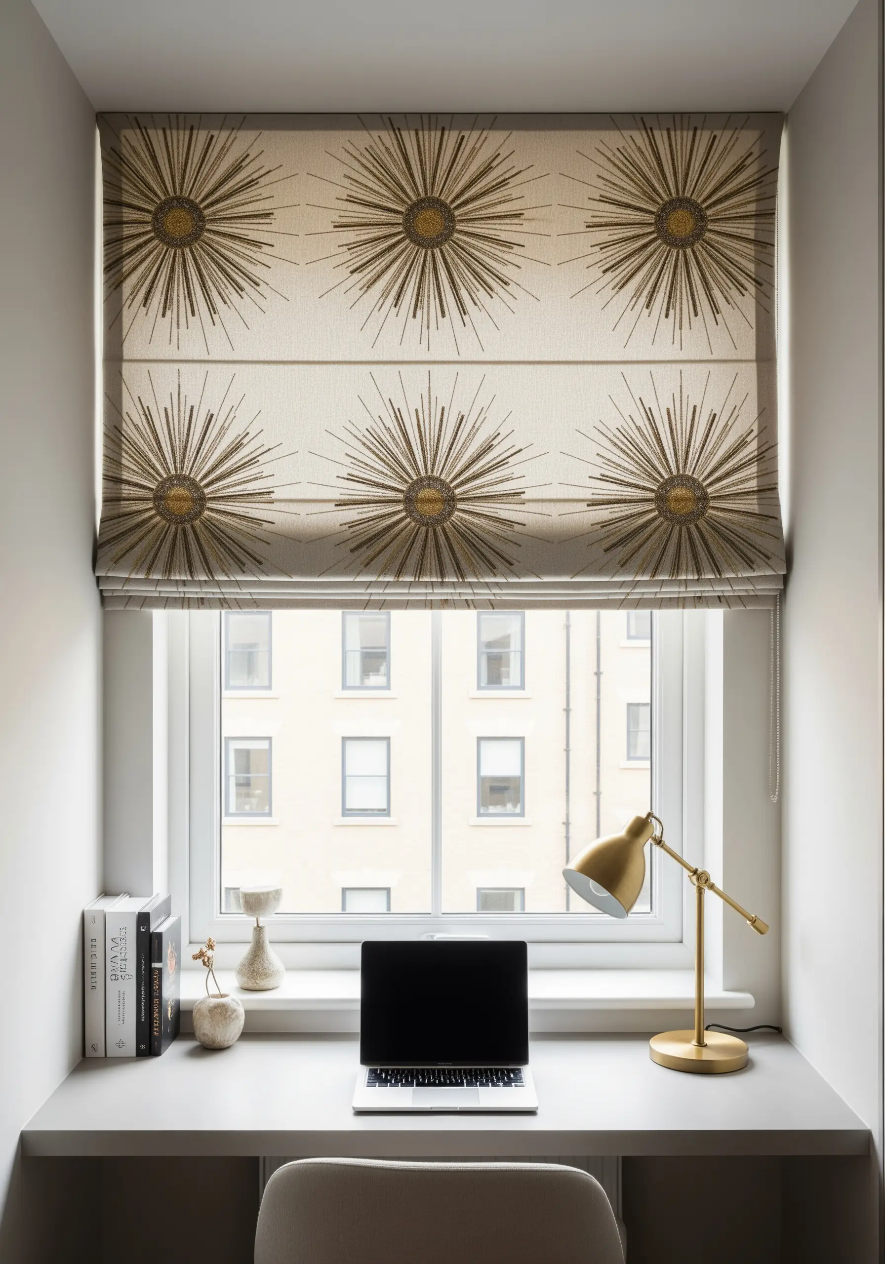 Gold and brown embroidered sunburst pattern on a neutral Roman blind.