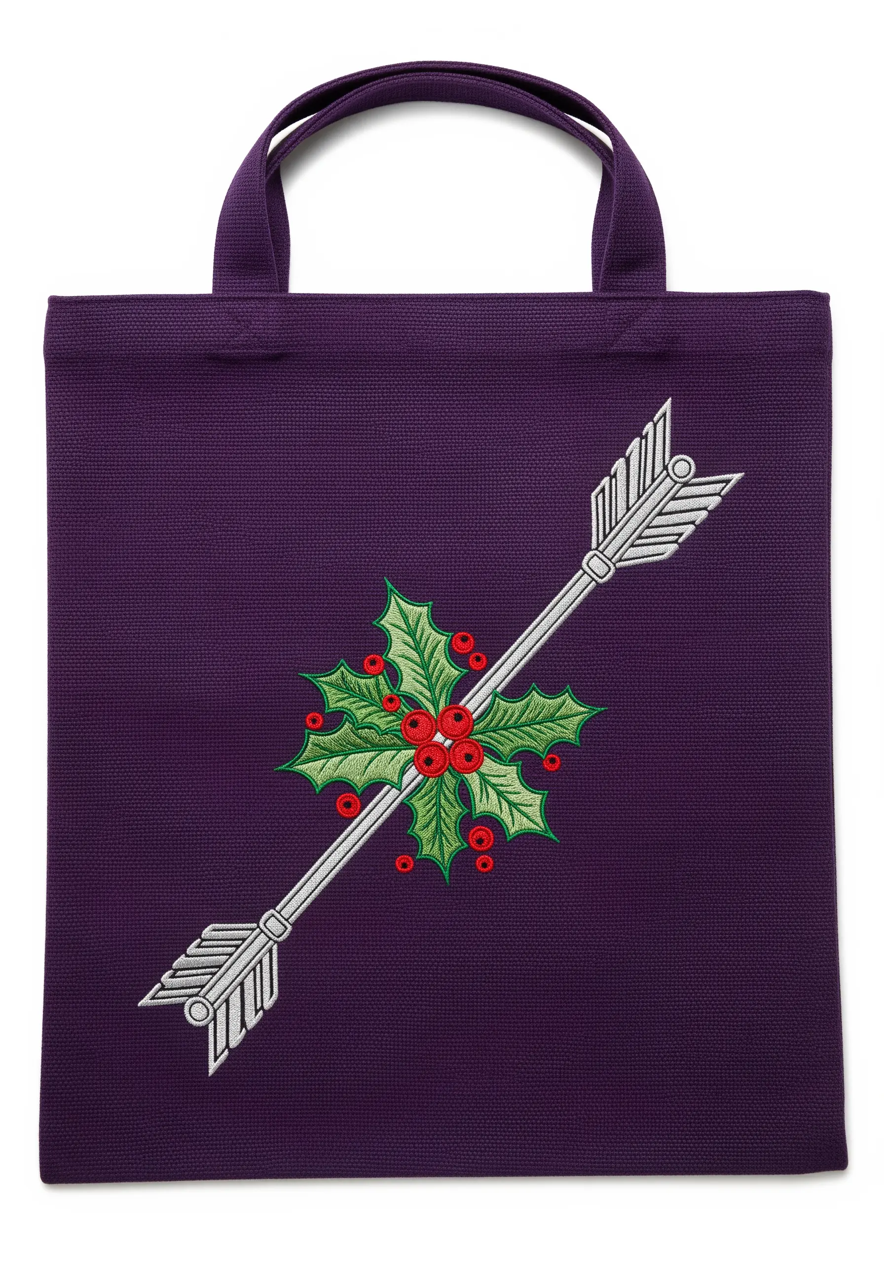 A white embroidered arrow for Sagittarius, crossed with a sprig of holly with red berries.