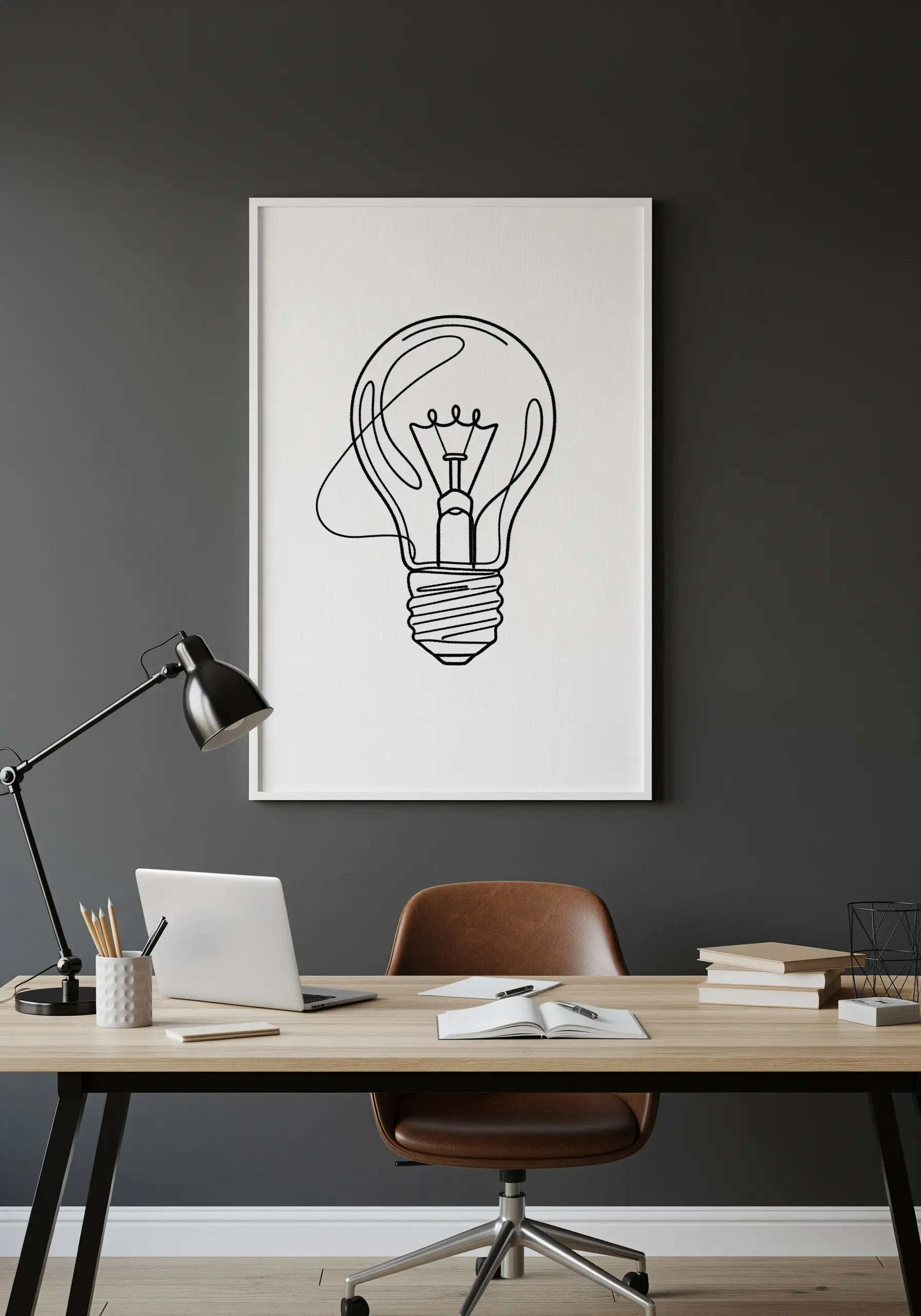 Large framed single-line art embroidery of a lightbulb.
