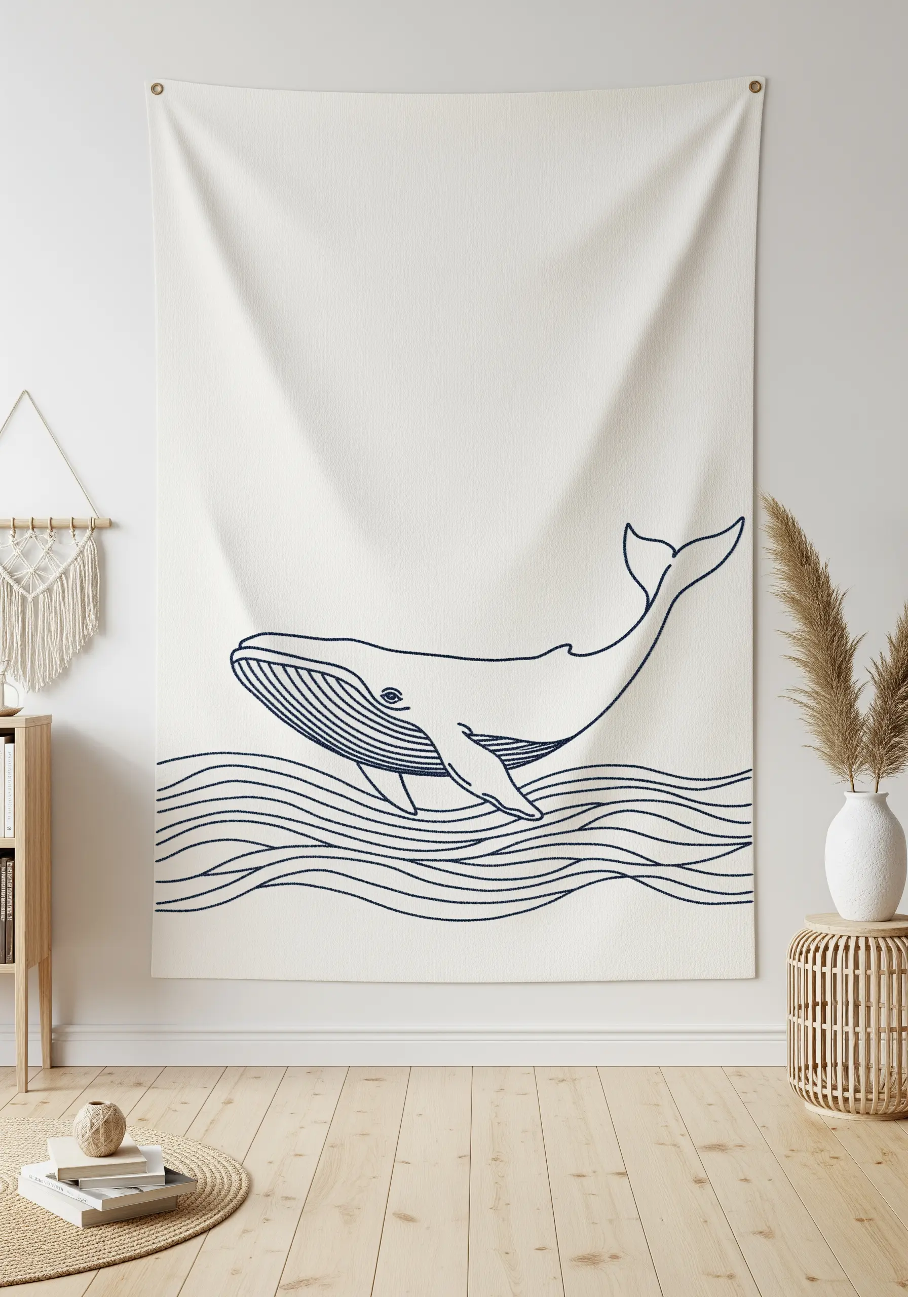 Large embroidered wall tapestry of a whale and waves in navy blue thread.