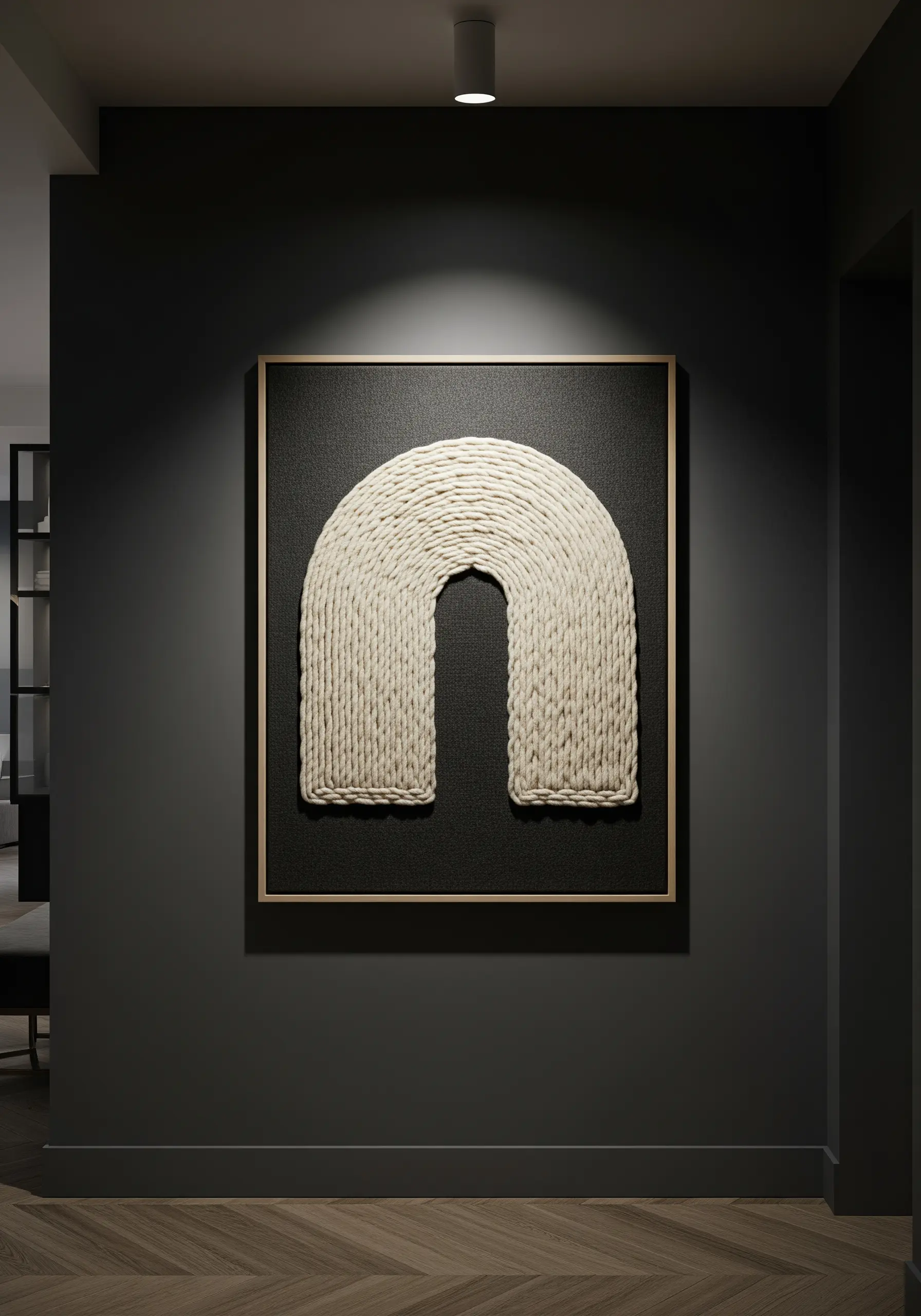 A large framed artwork with a thick, sculptural arch made of white yarn on a black background.
