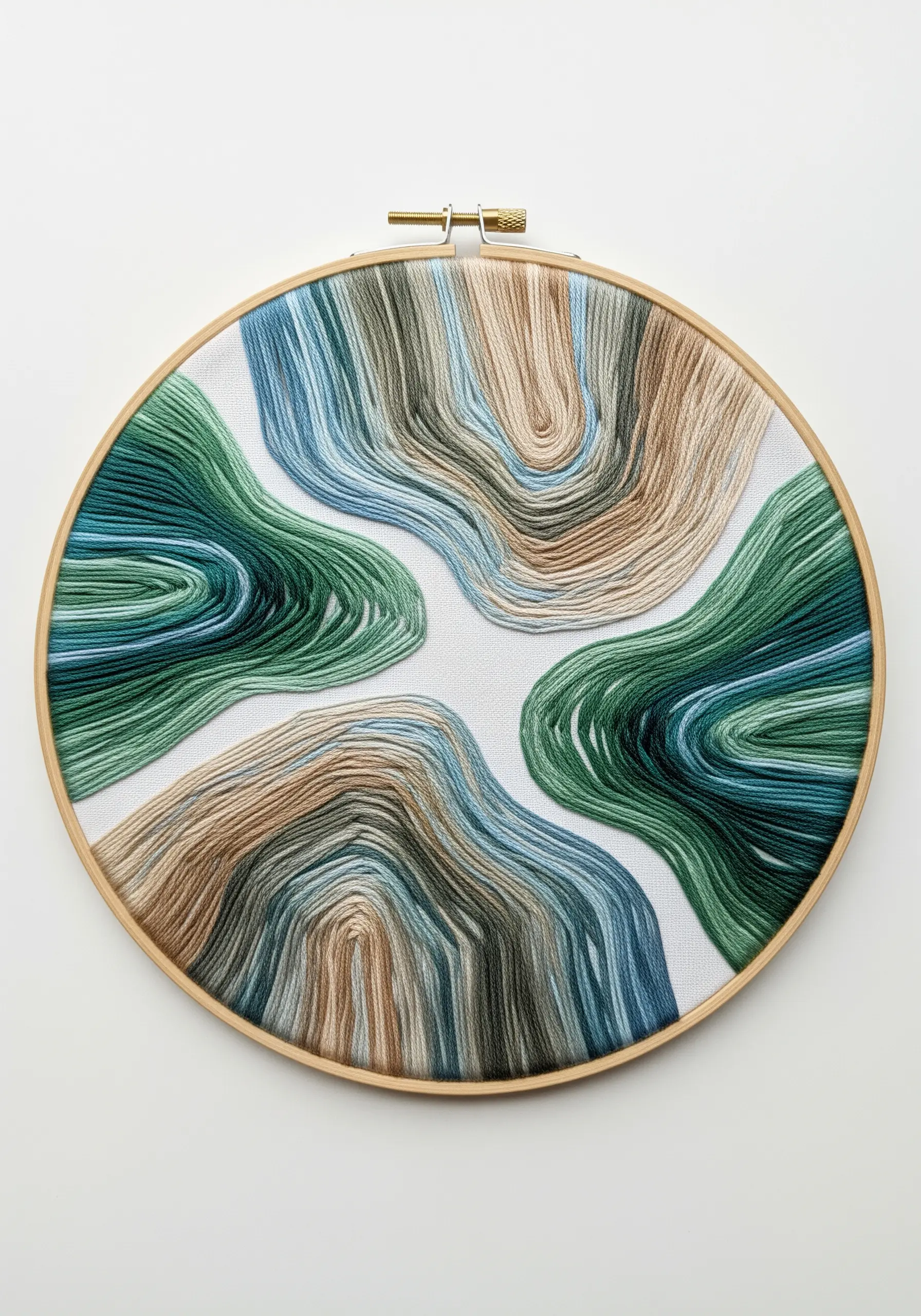 Abstract organic shapes filled with contoured satin stitches in greens, blues, and beige.