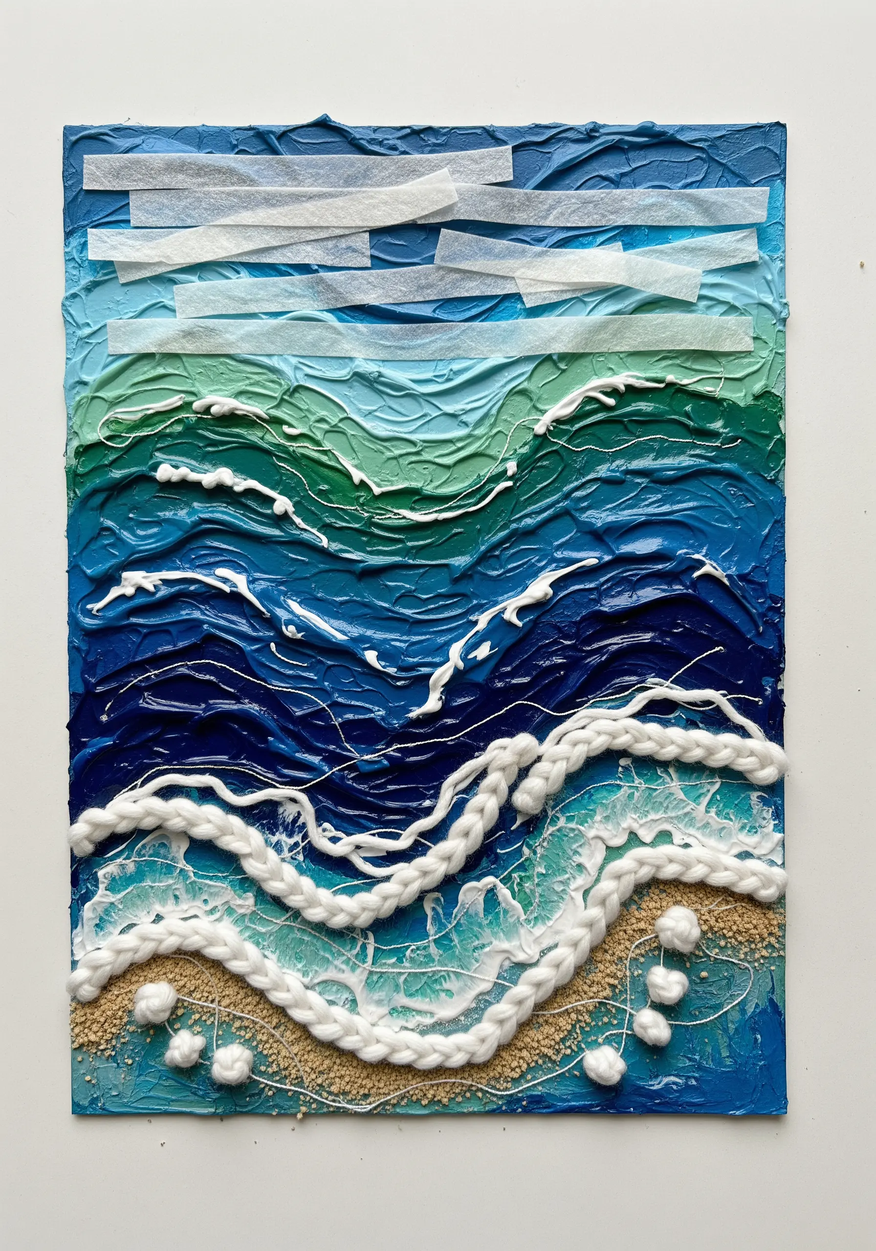 Mixed-media ocean scene with thick paint, couched yarn waves, and sand texture.