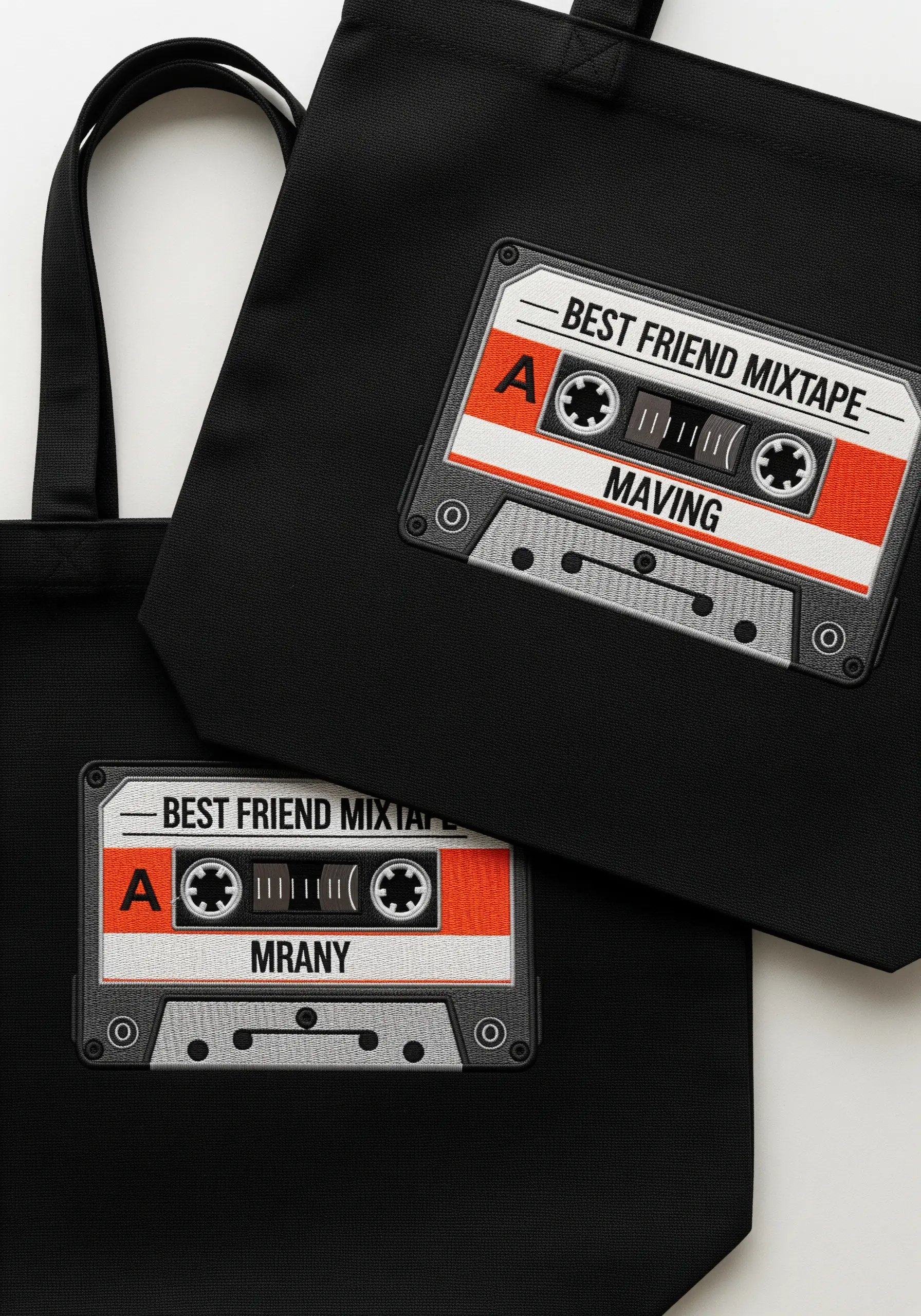 Black tote bags with personalized, retro embroidered cassette tape mixtape designs.