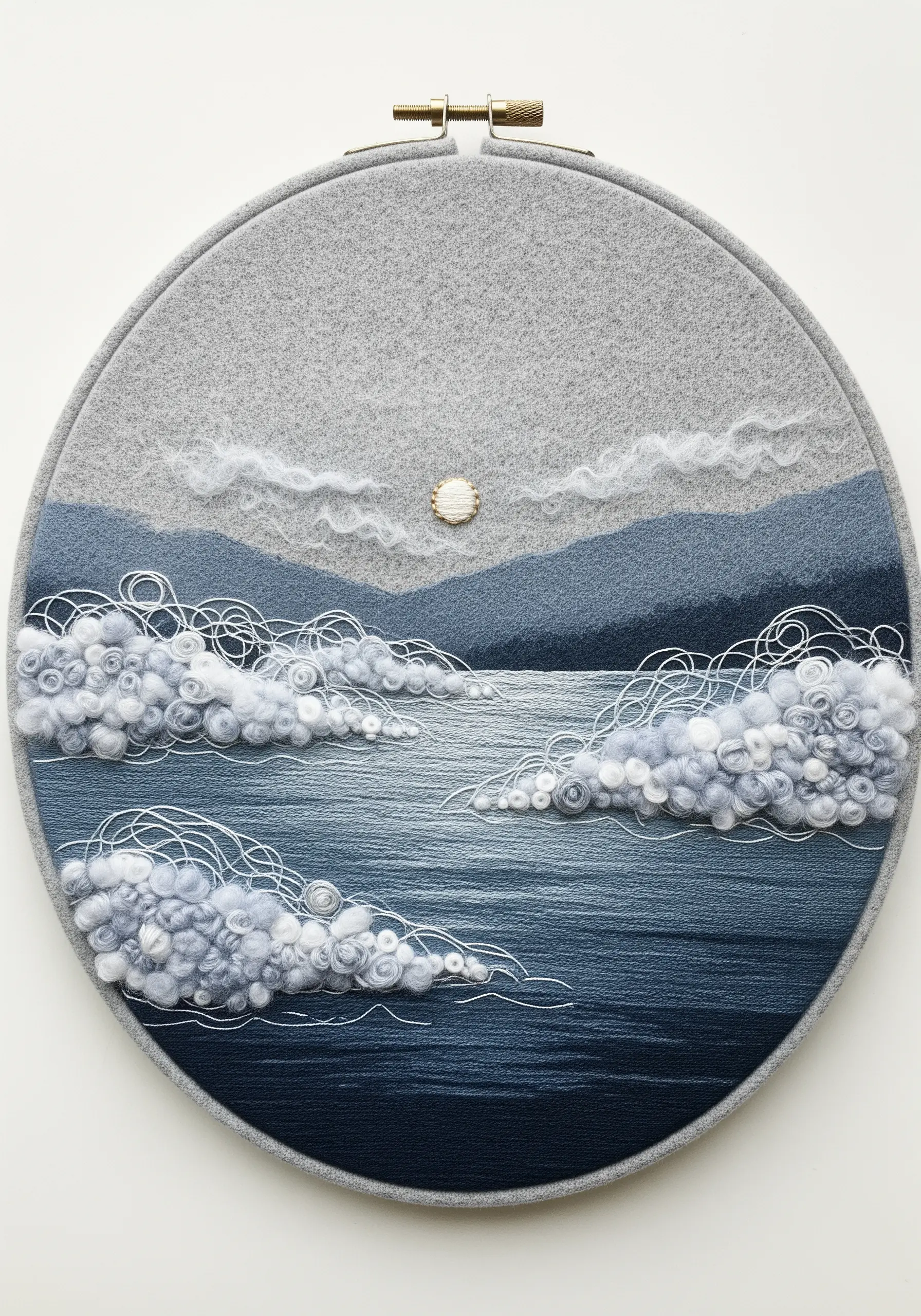 A landscape of a lake and mountains created with needle-felted wool and fine embroidery.