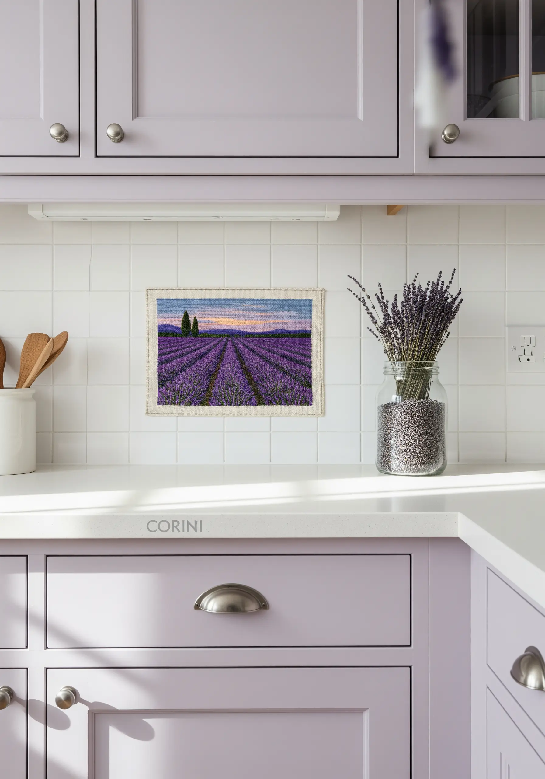 A hyper-realistic embroidered landscape of a lavender field at sunset on a kitchen counter.
