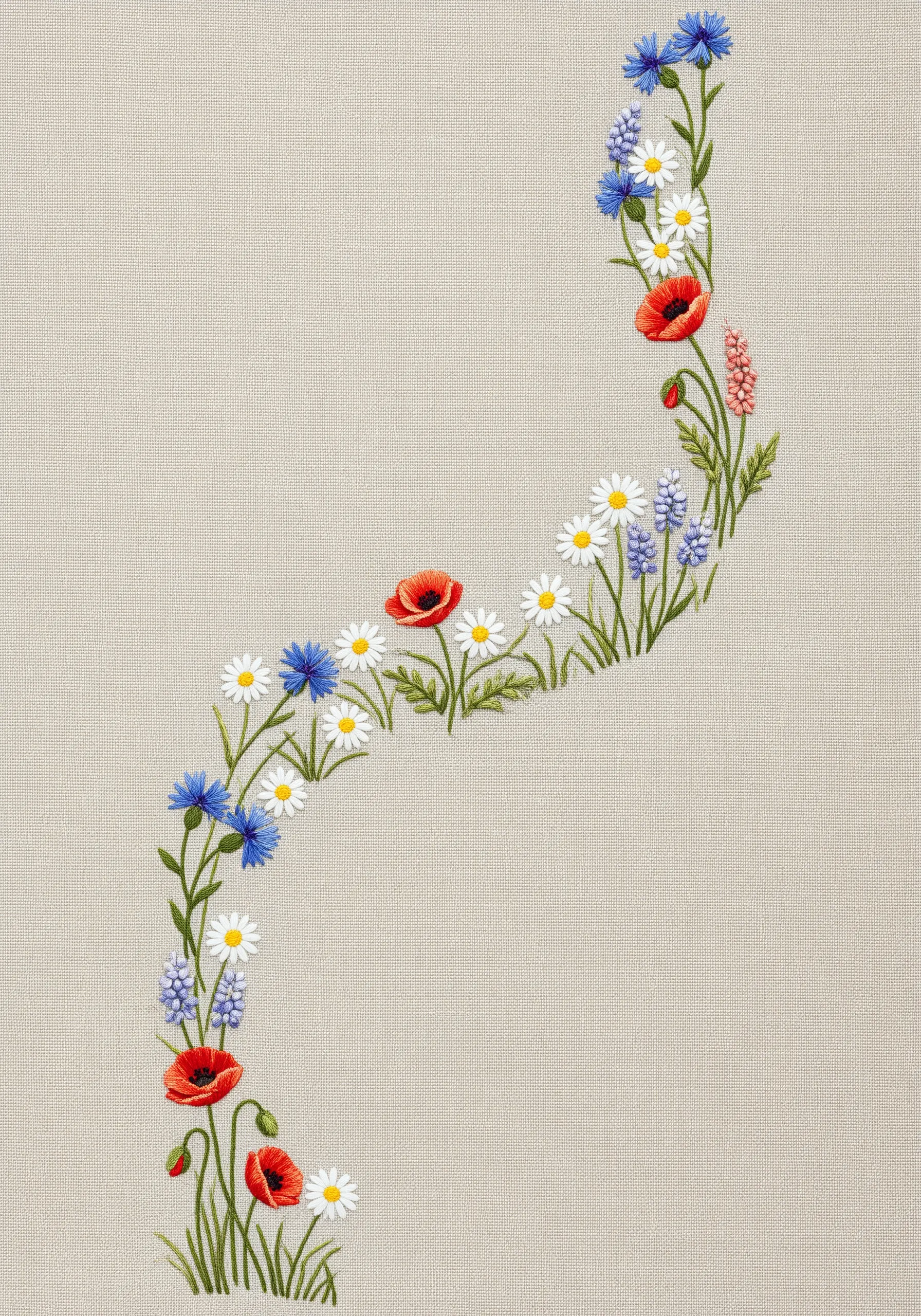 A meandering line of wildflowers like poppies and daisies embroidered on a linen runner.