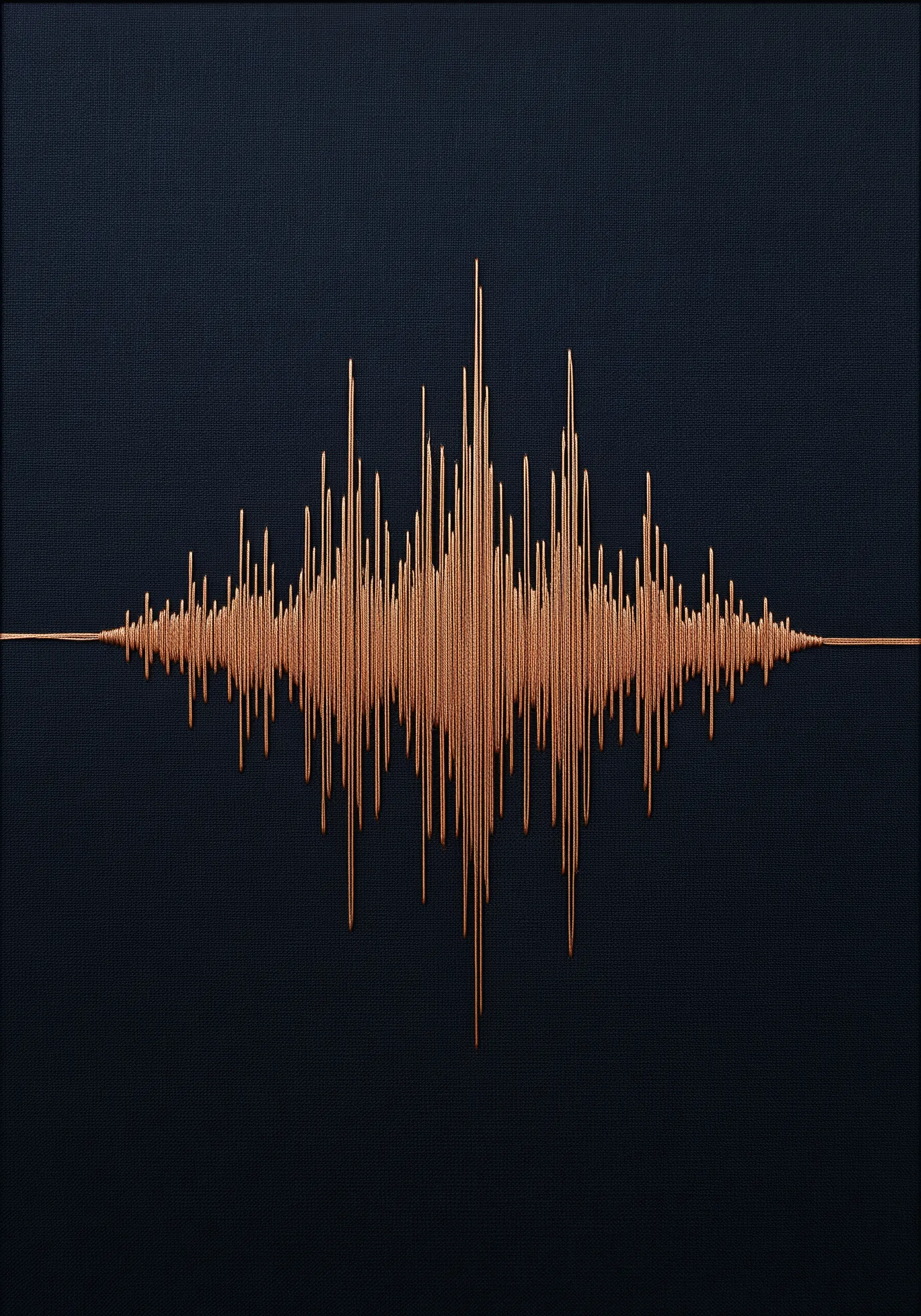 A copper-colored soundwave embroidered with metallic thread on a dark navy fabric background.