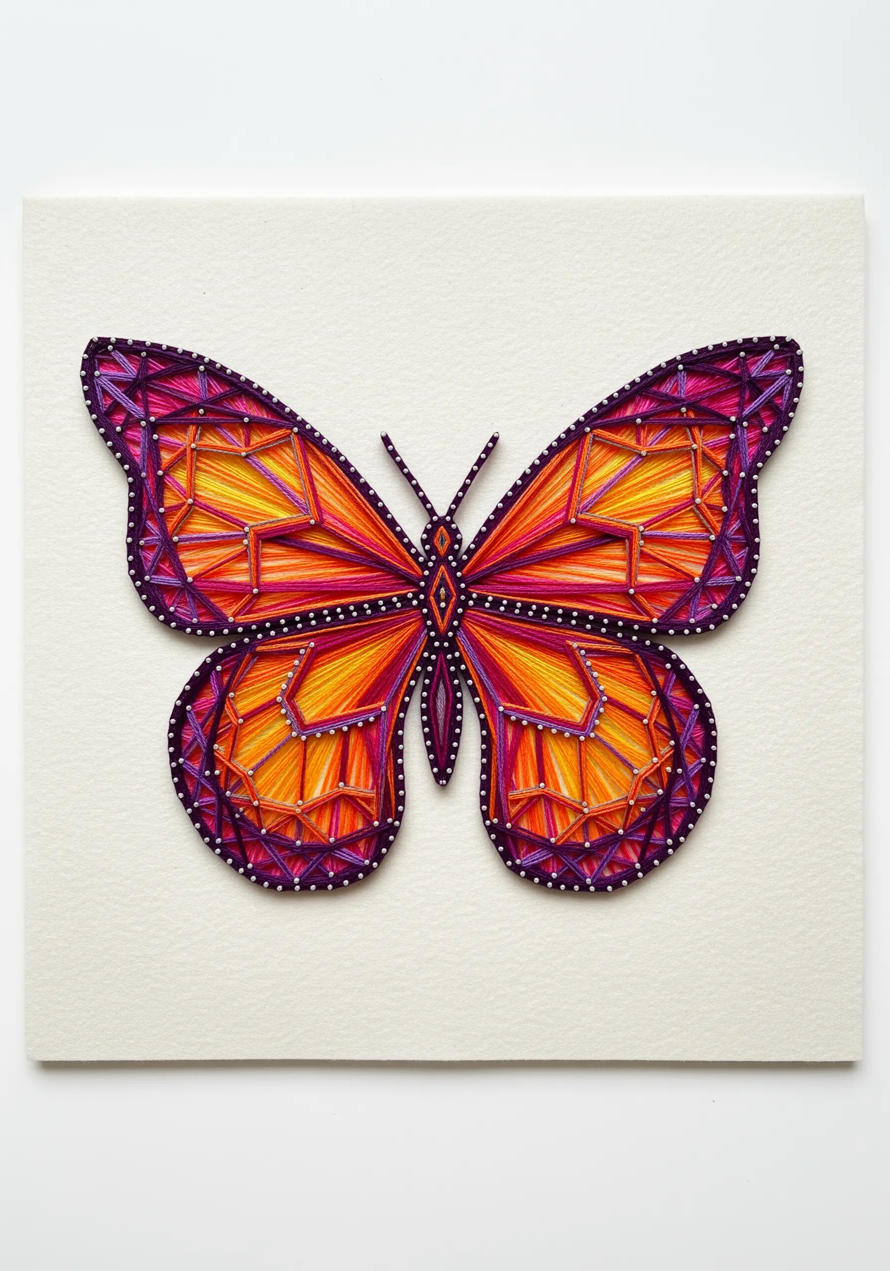 Symmetrical string art butterfly in orange, pink, and purple, outlined with white beads.