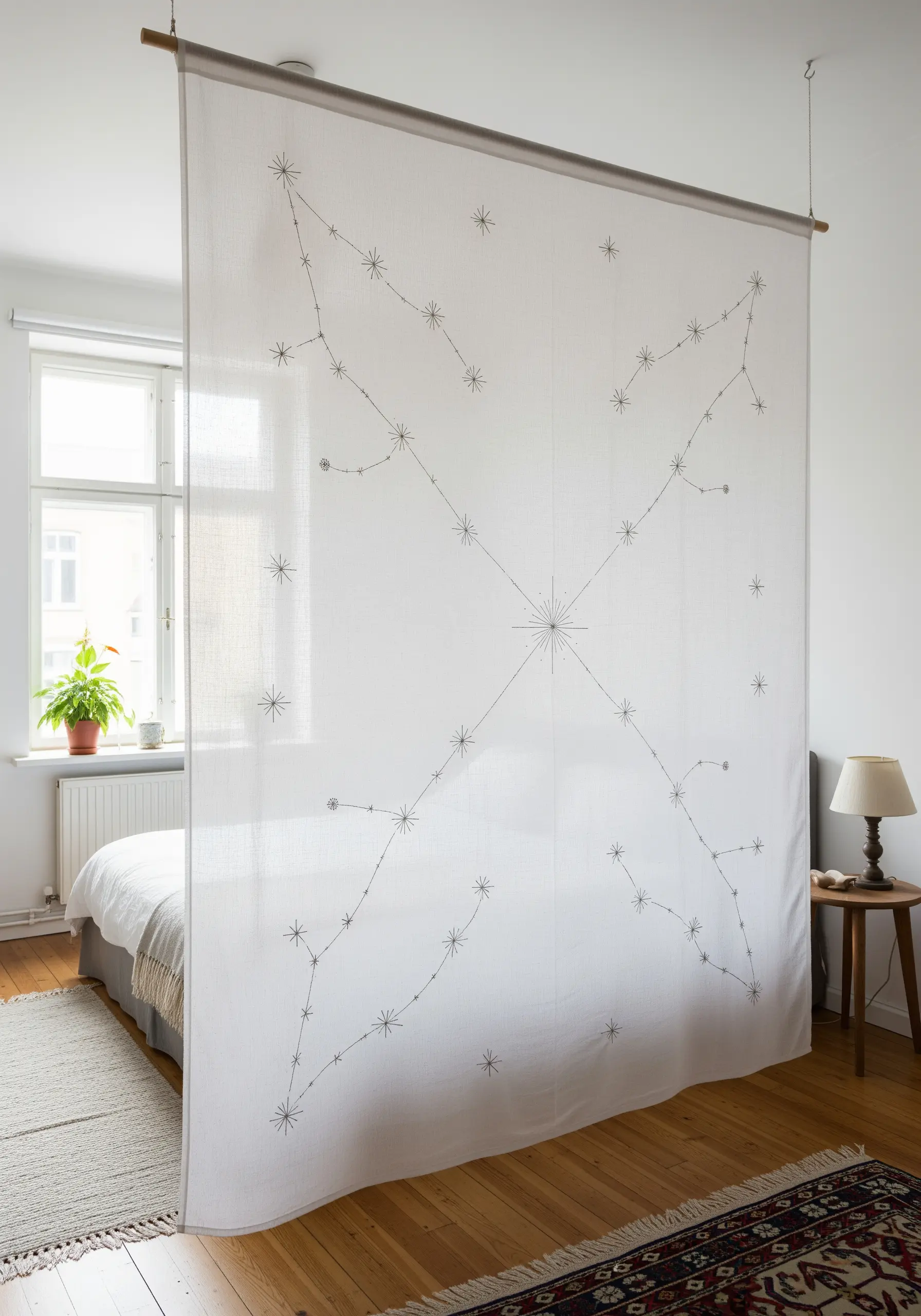 A large, sheer fabric room divider embroidered with a delicate, geometric constellation pattern.