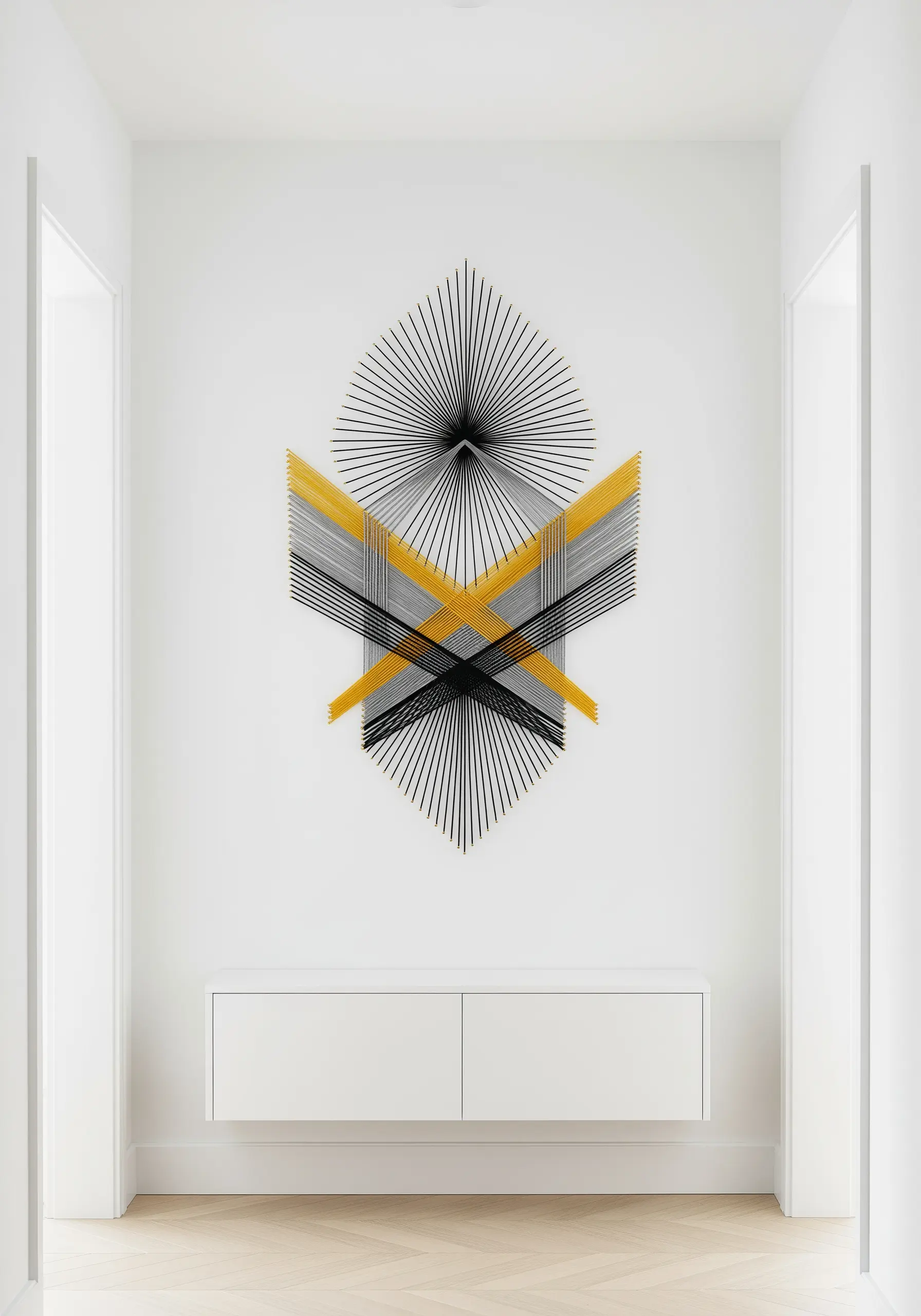 Geometric string art piece with black, white, and yellow threads creating optical patterns.