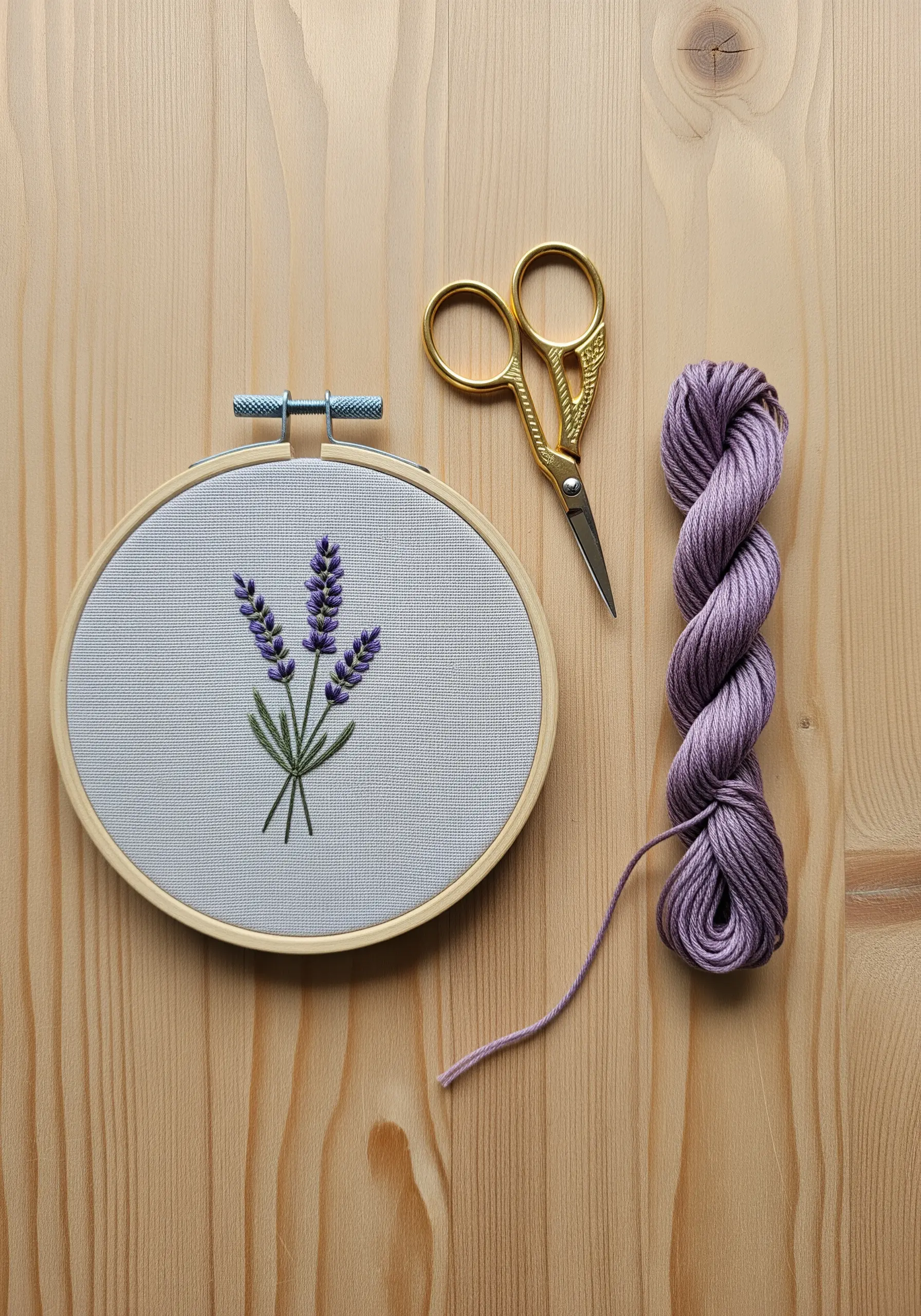 Detailed lavender sprigs embroidered with textured stitches in purple and green.