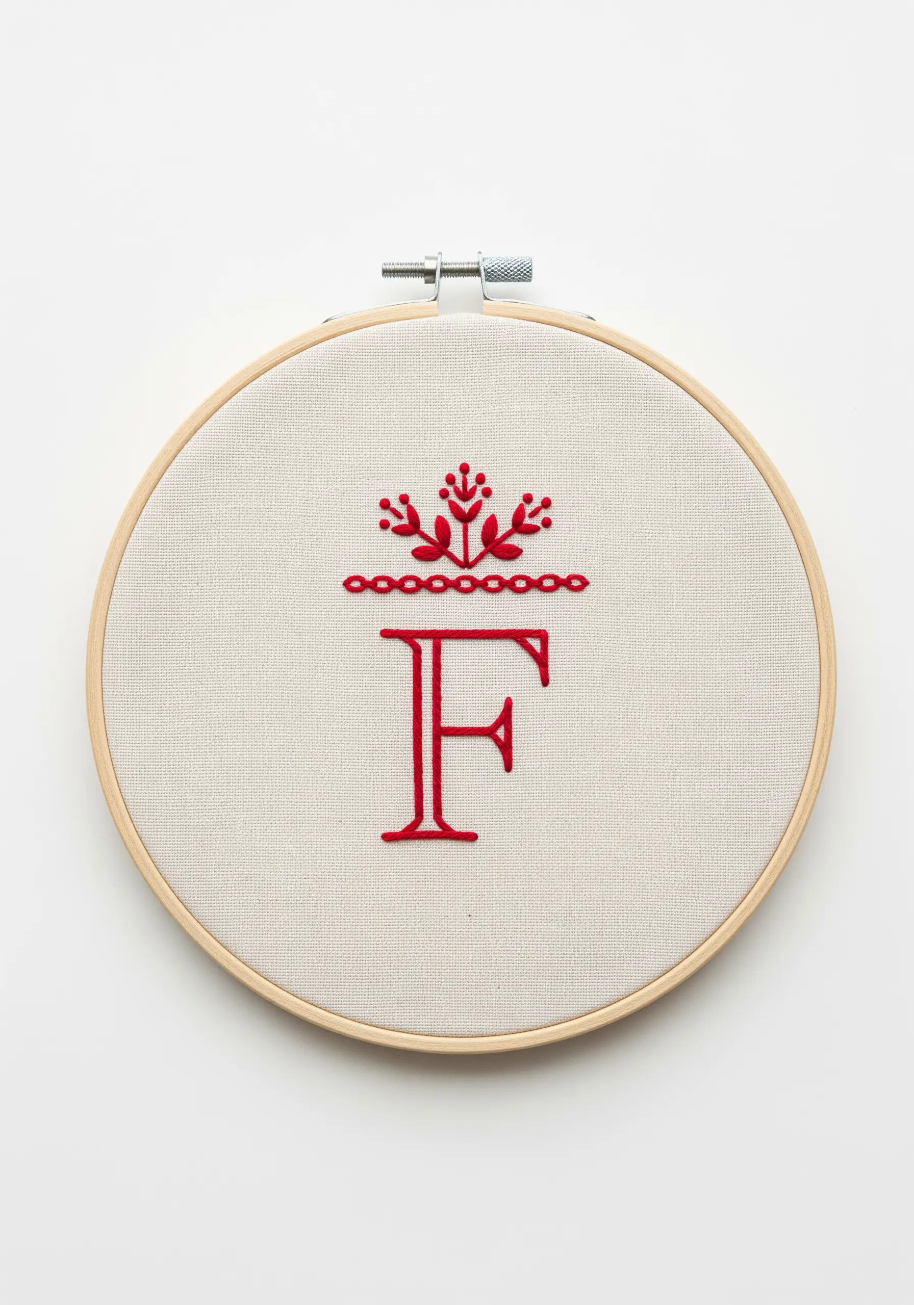 Red folk-art style 'F' monogram topped with a floral motif.