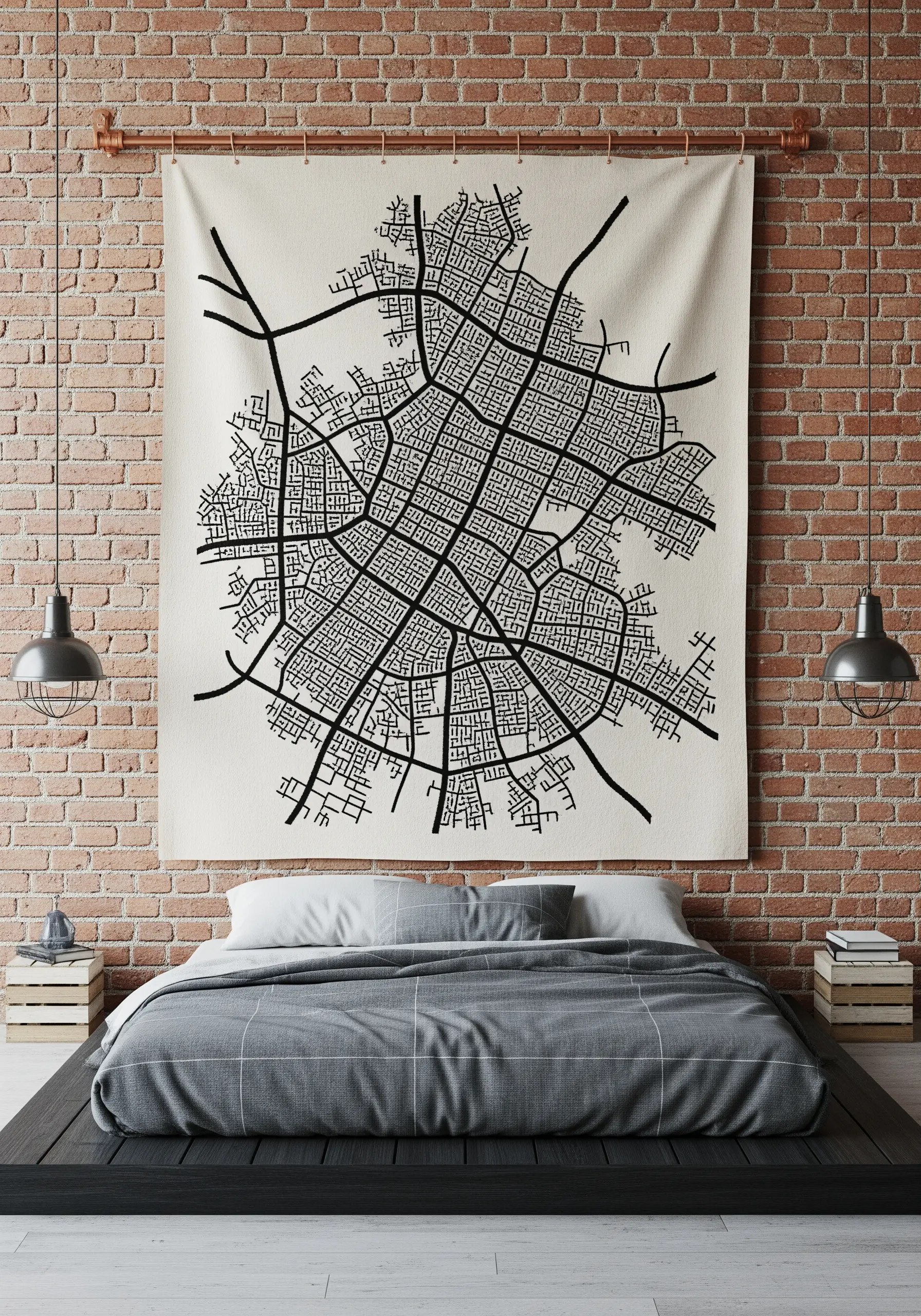 A large wall tapestry featuring an embroidered black-and-white map of a city grid.