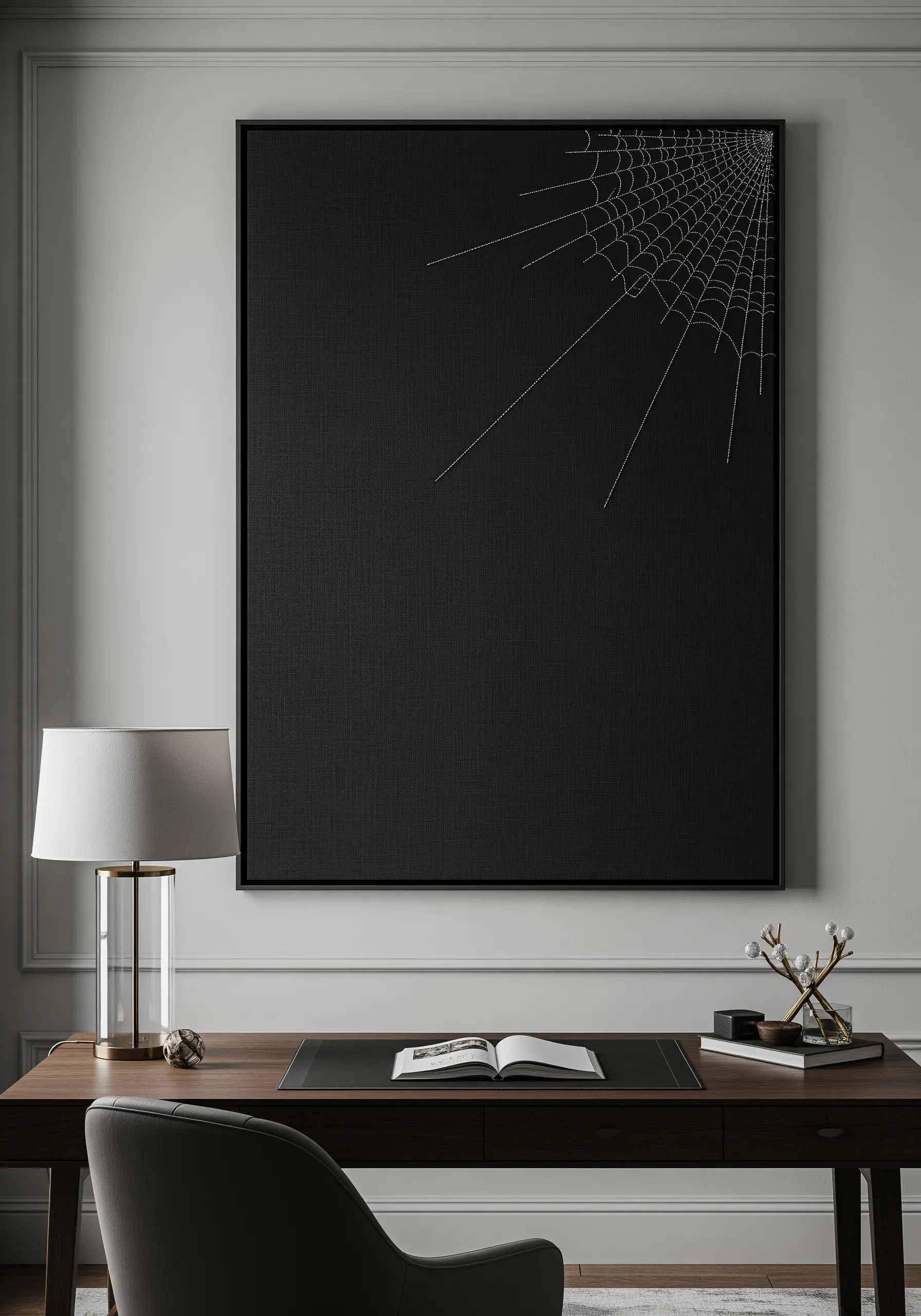 A delicate, geometric spiderweb stitched in white in the corner of a large black canvas.