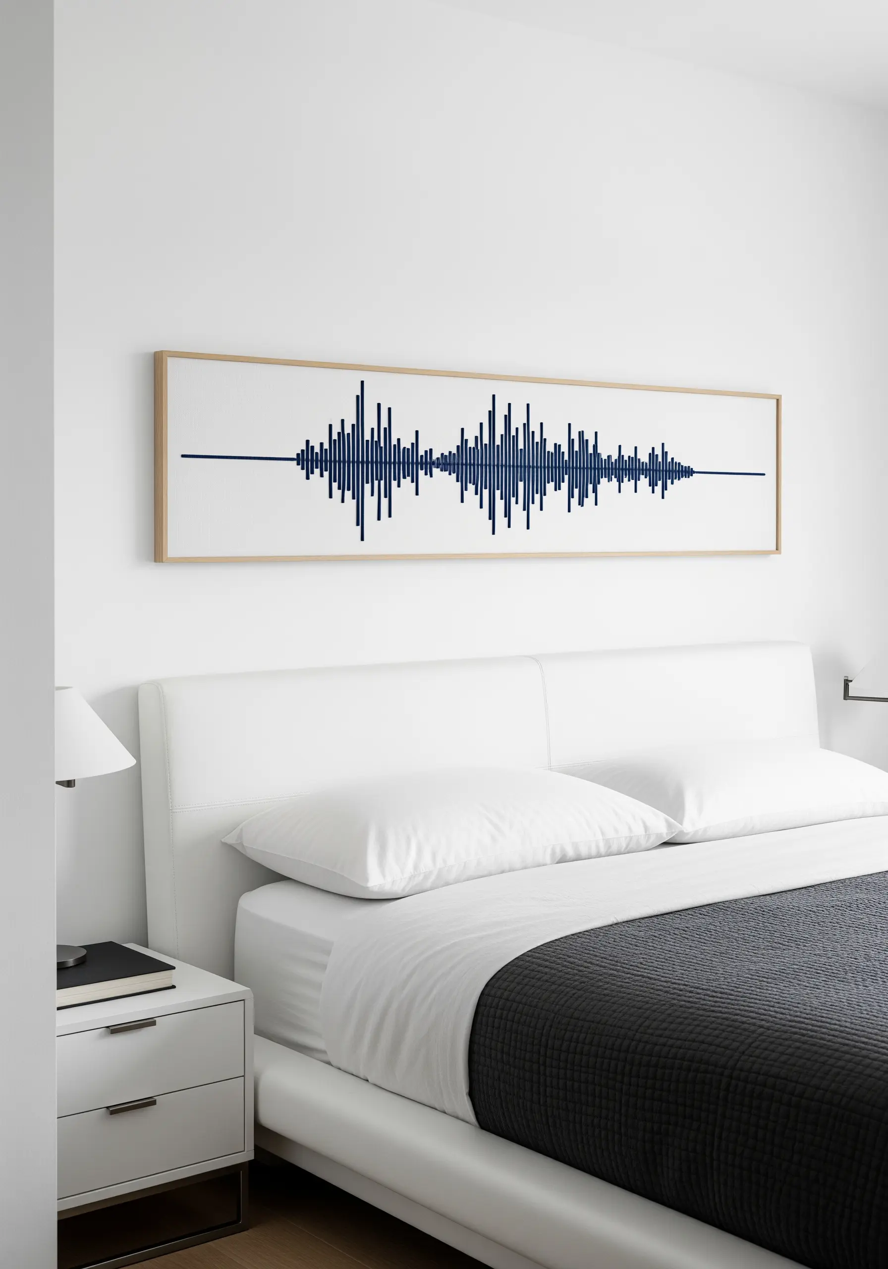 A framed embroidery depicting the soundwave of a song or voice in dark blue thread.