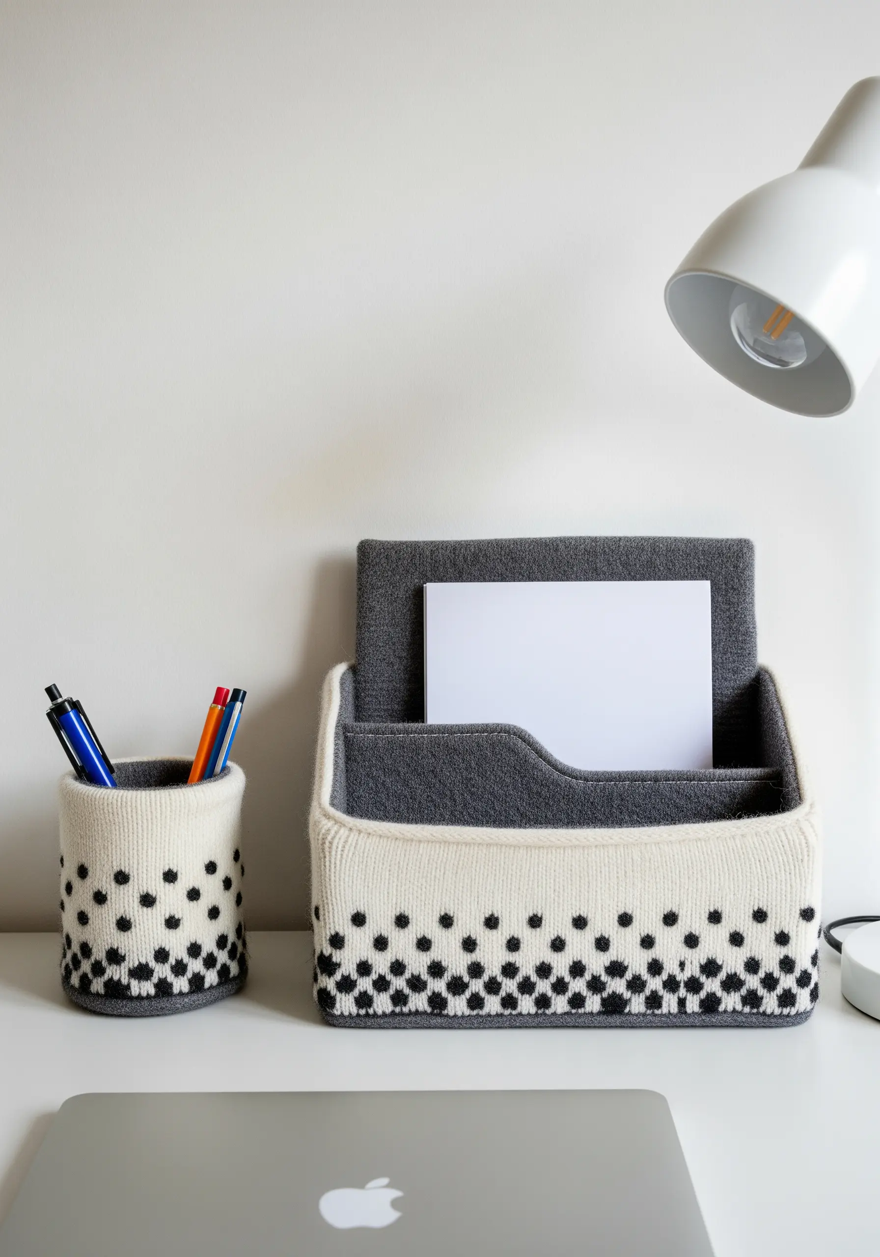 Desk organizers (a pen pot and letter holder) covered in upcycled knit sweater fabric.