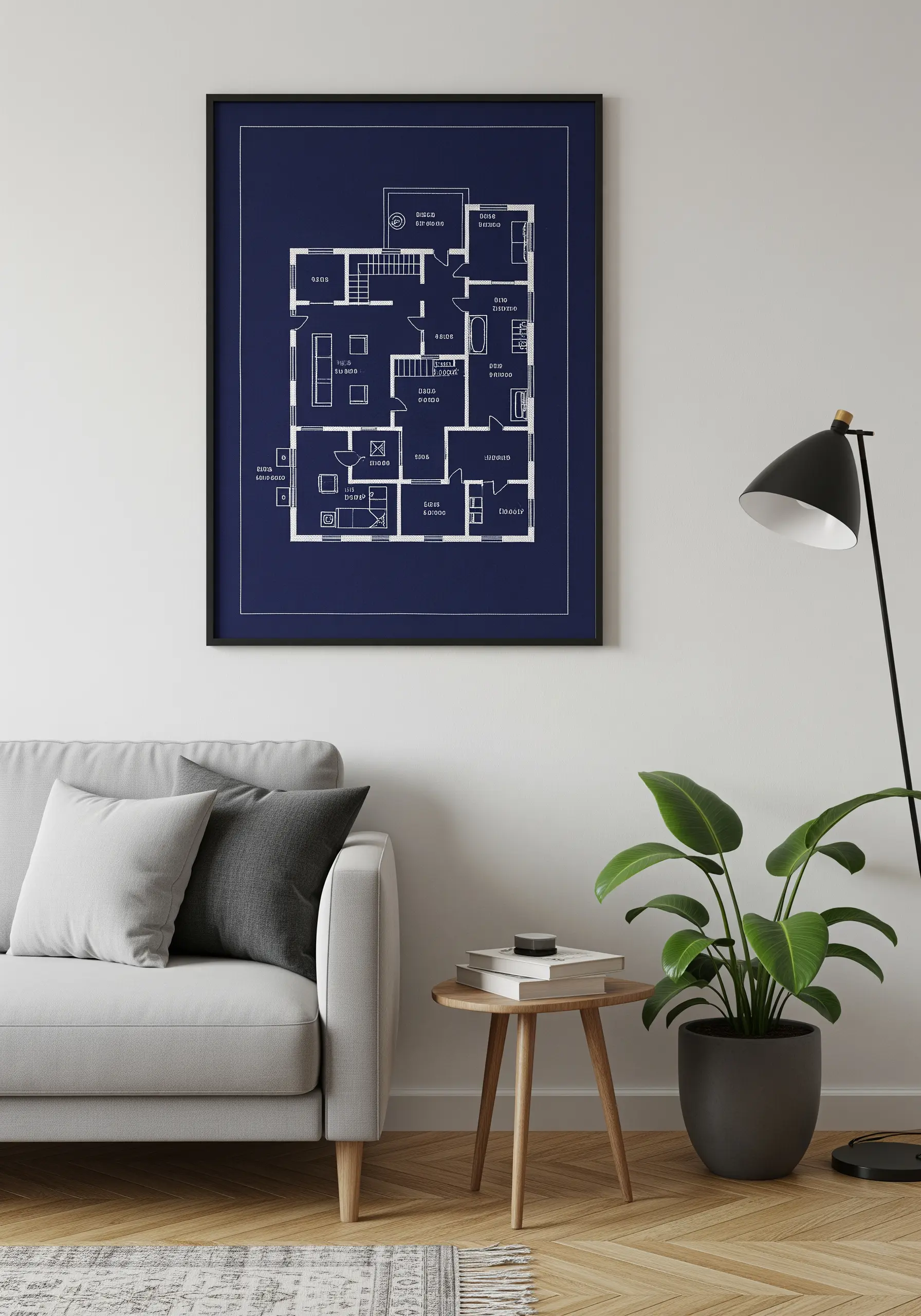 An architectural floor plan stitched in white thread on a dark blue background.