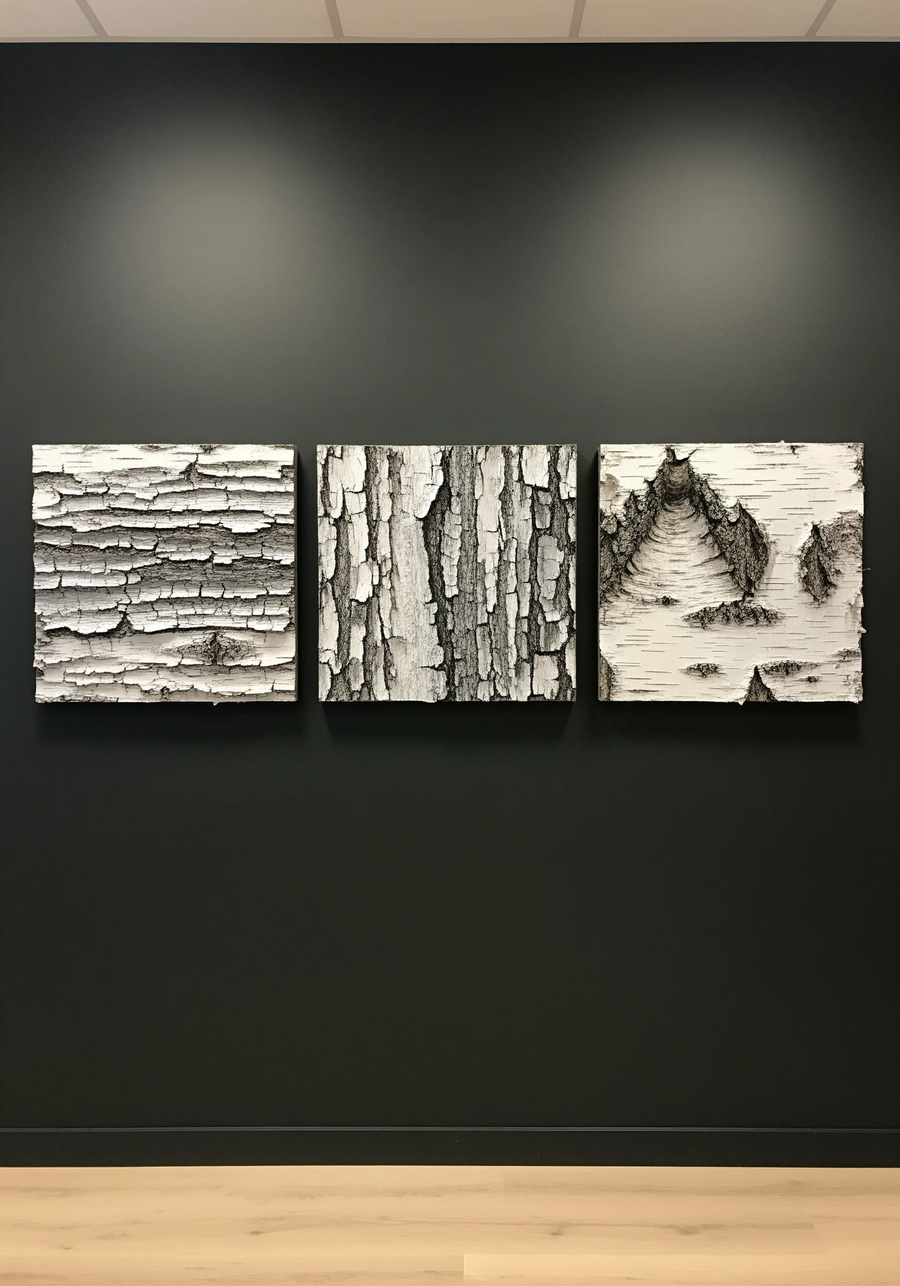 A triptych of square canvases showing highly detailed, textured embroidery of white birch bark.