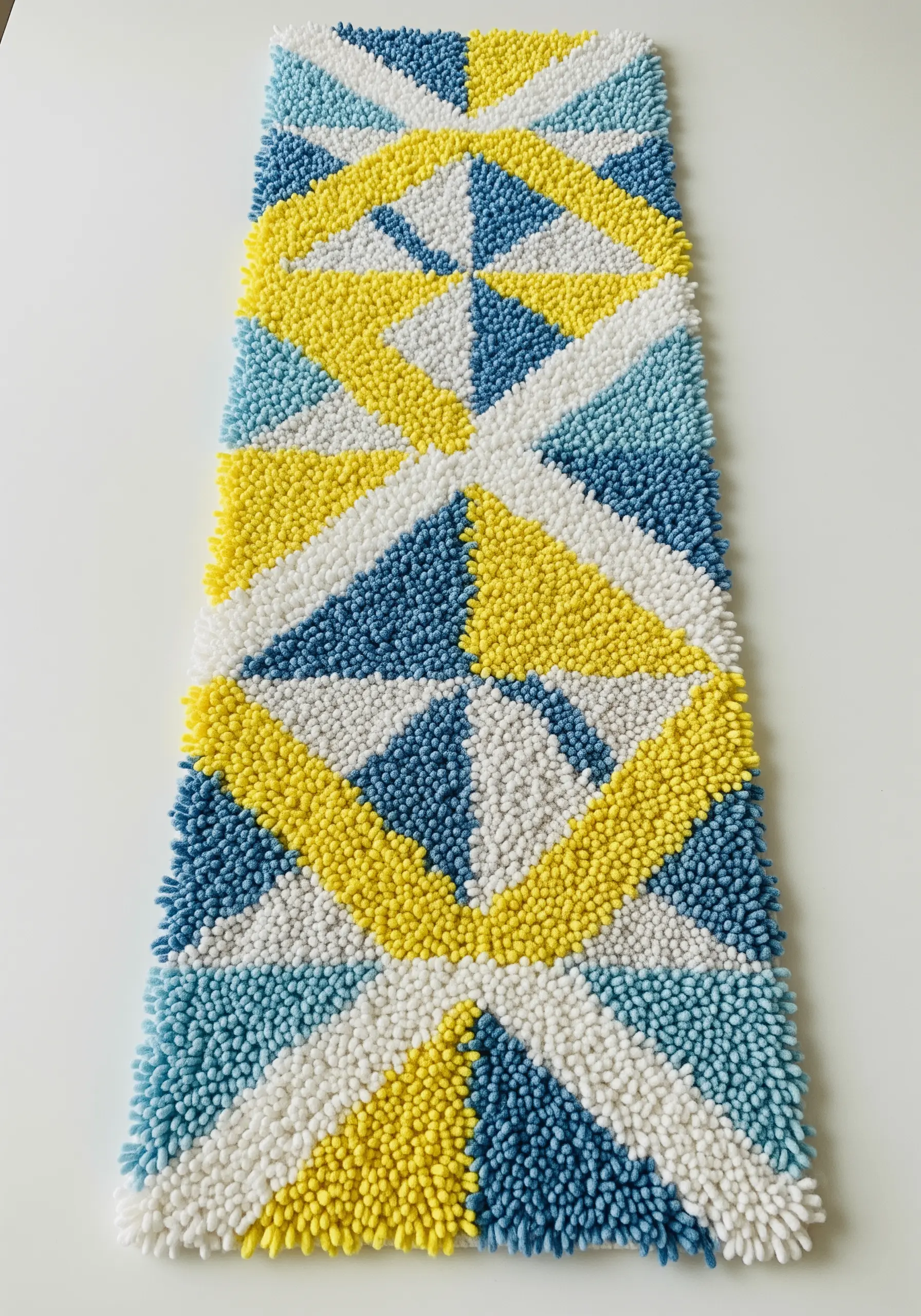 A long, tufted runner with a geometric pattern of triangles in blue, yellow, and white.